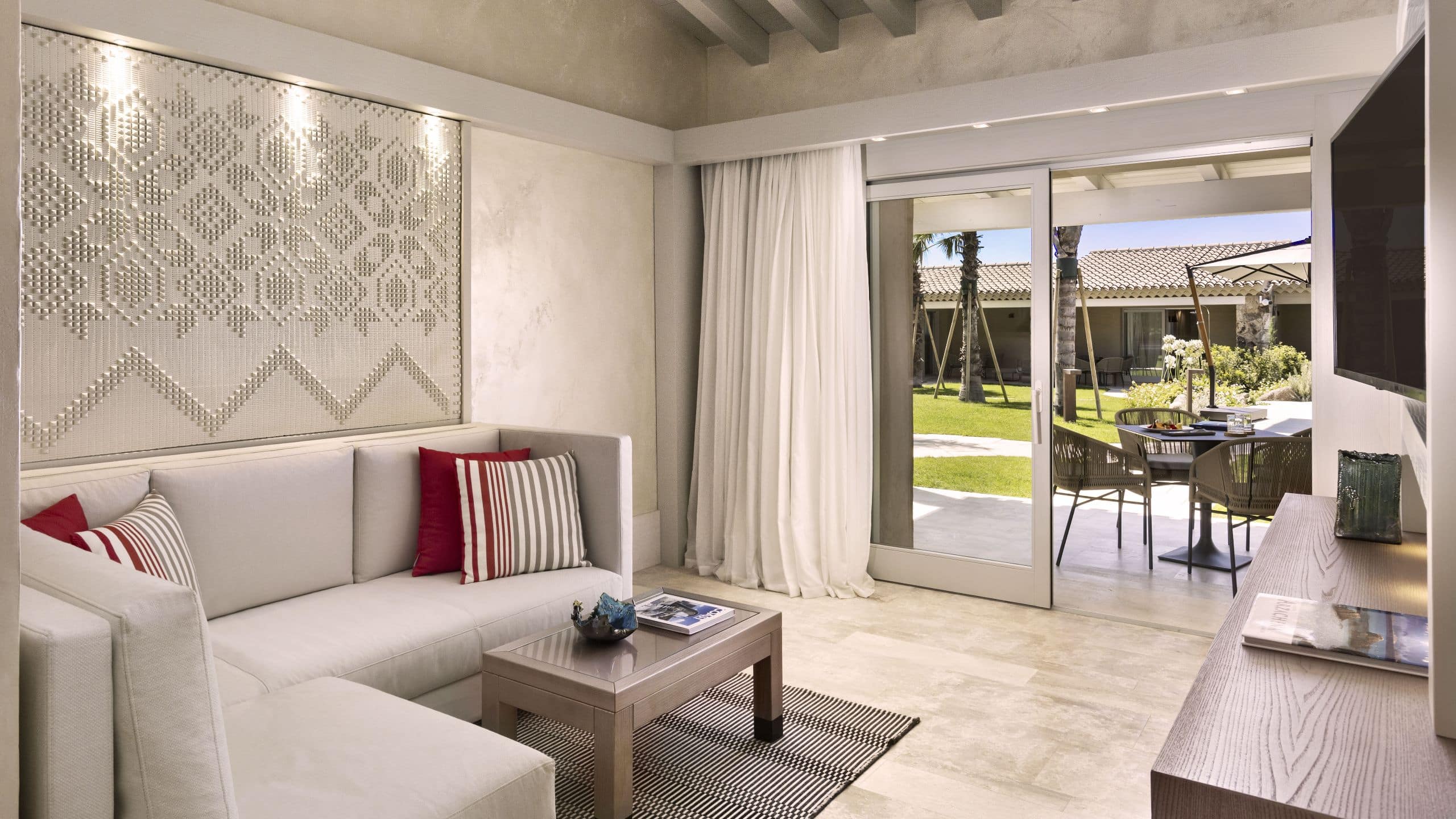 2 of 10 7Pines Resort Sardinia Laguna Suite Living Room View