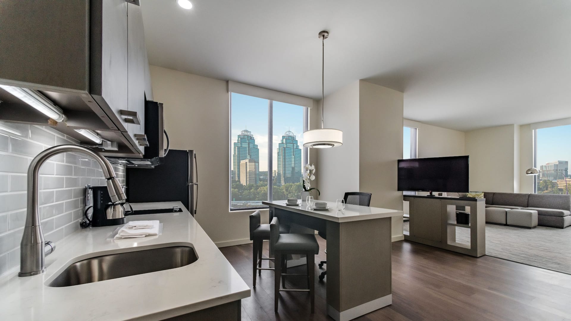 One Bedroom Kitchen Suite with king bed and living area at Hyatt House Atlanta/Perimeter Center