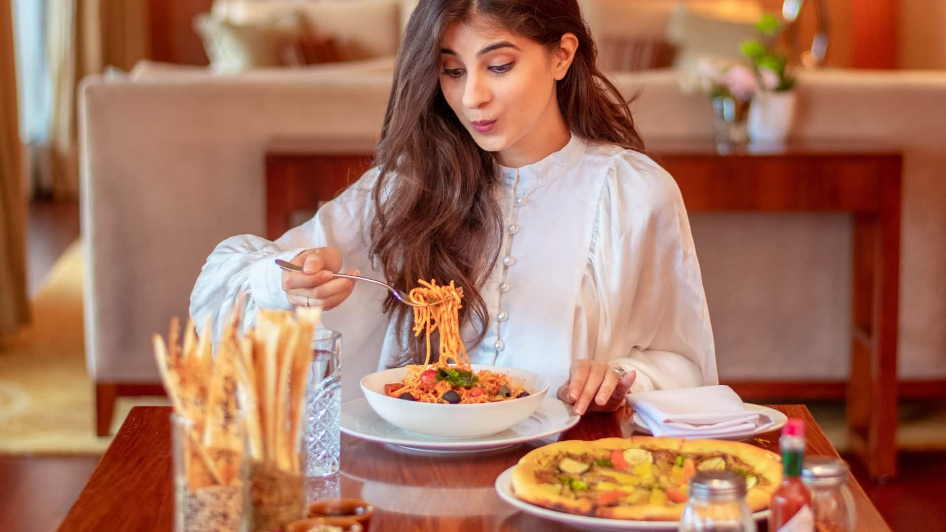 Hyatt Regency Pune & Residences Suite Living Room Woman Dining
