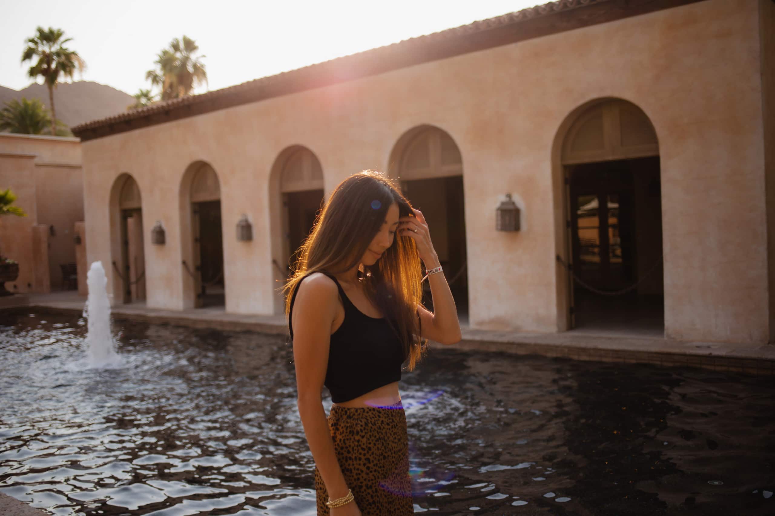 Royal Palms Resort and Spa Woman By Reflecting Pool