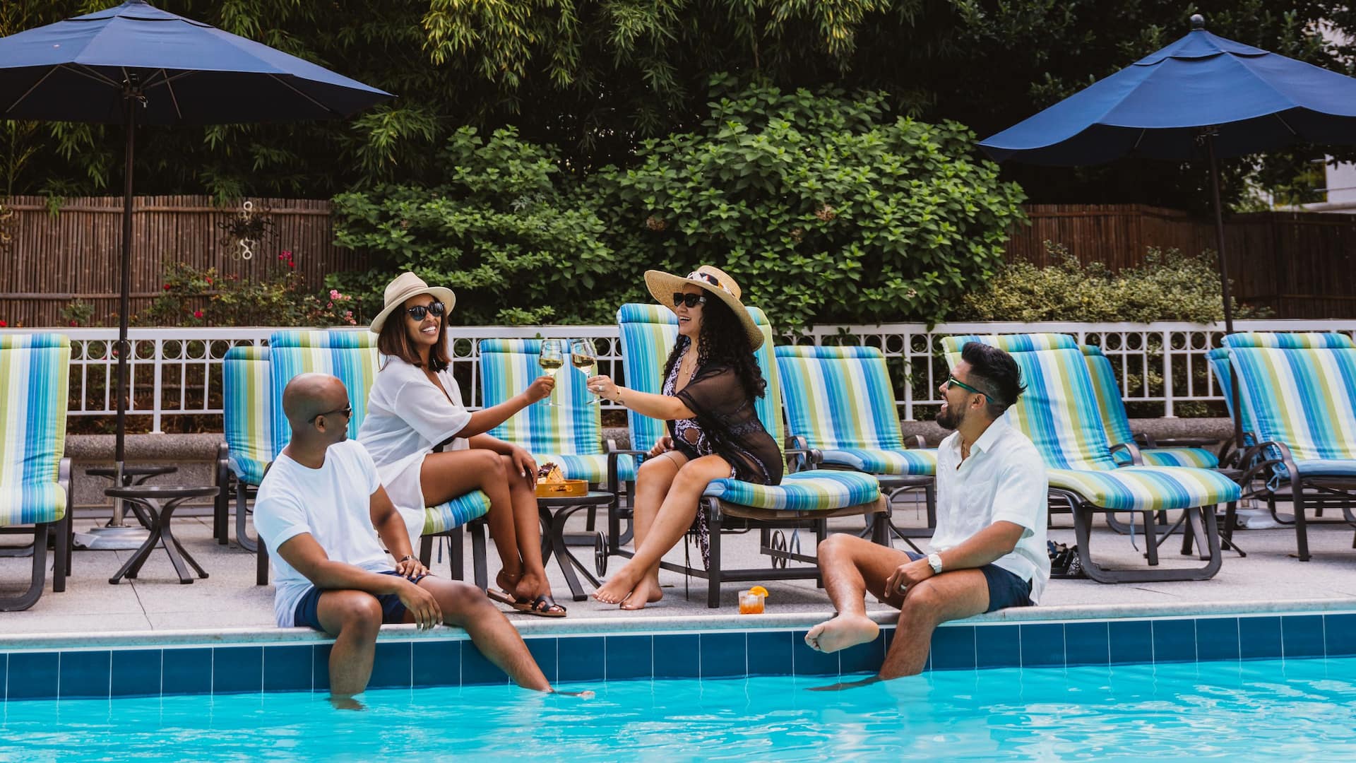 Grand Hyatt Atlanta in Buckhead Group Sitting By Pool Cheers Vertical