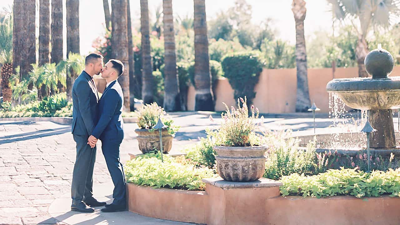 Royal Palms Resort and Spa LGBTQ Wedding Couple at Entry