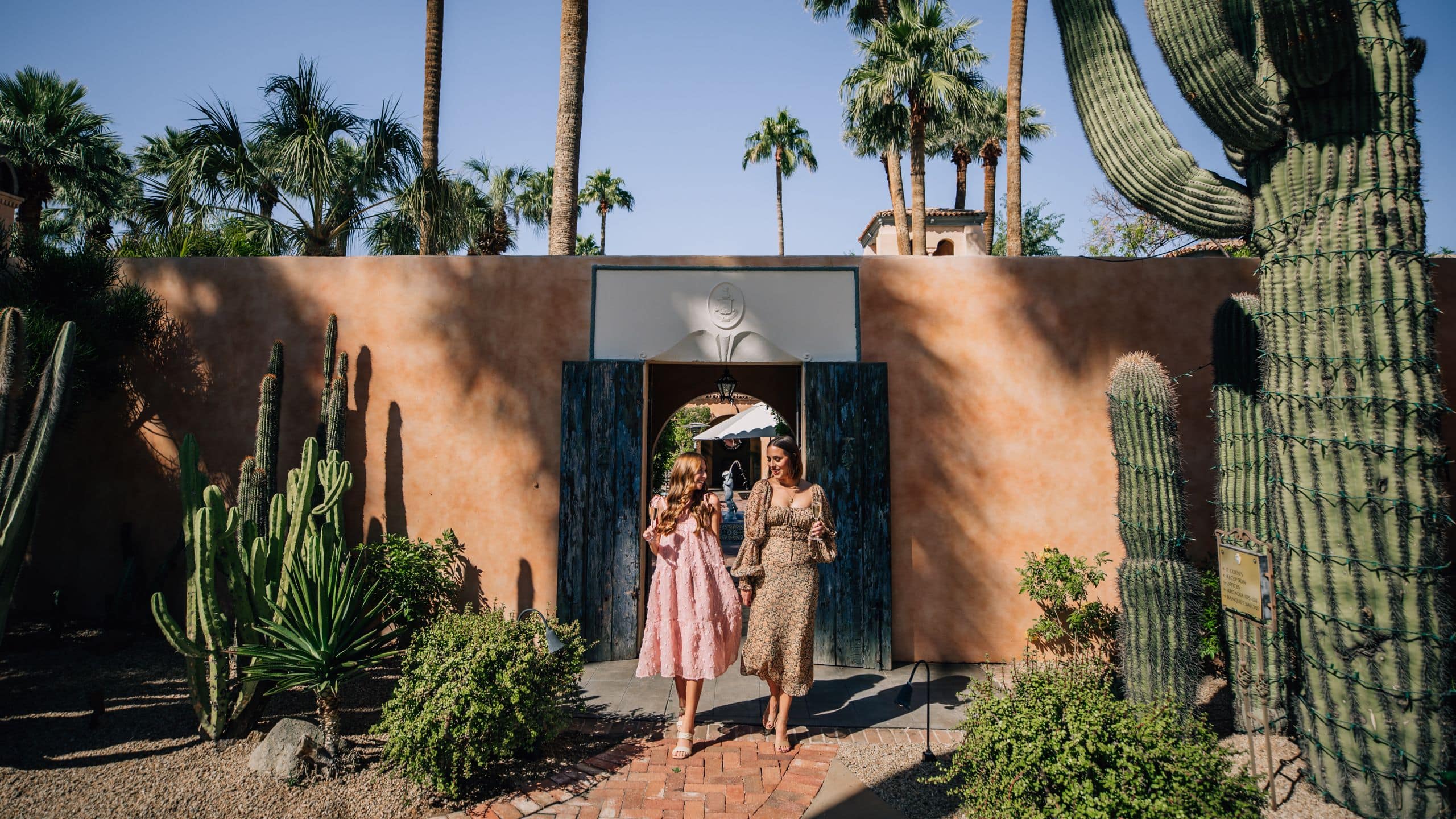 Royal Palms Resort and Spa Guests Outside Mansion Courtyard