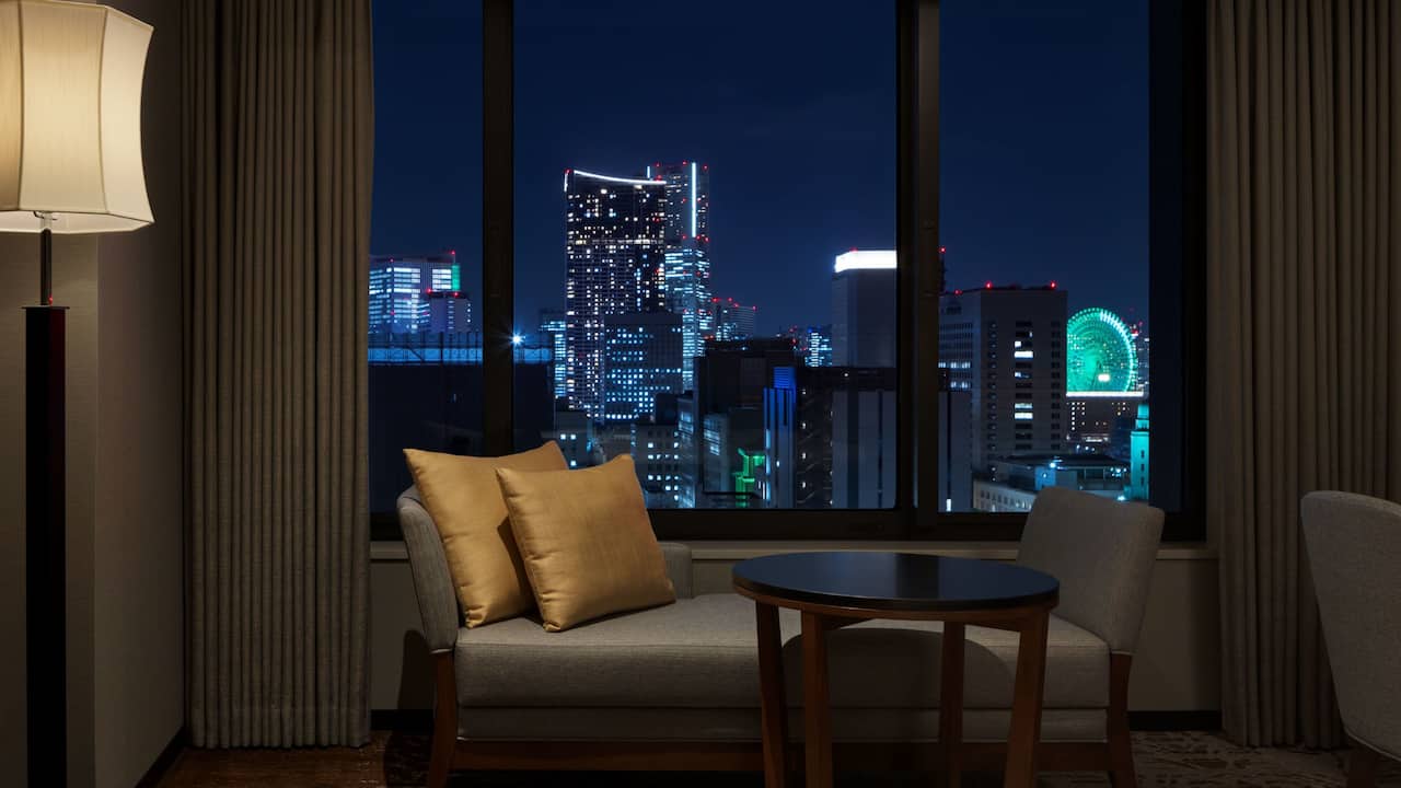 Club Room overlooking the night view of Yokohama city
