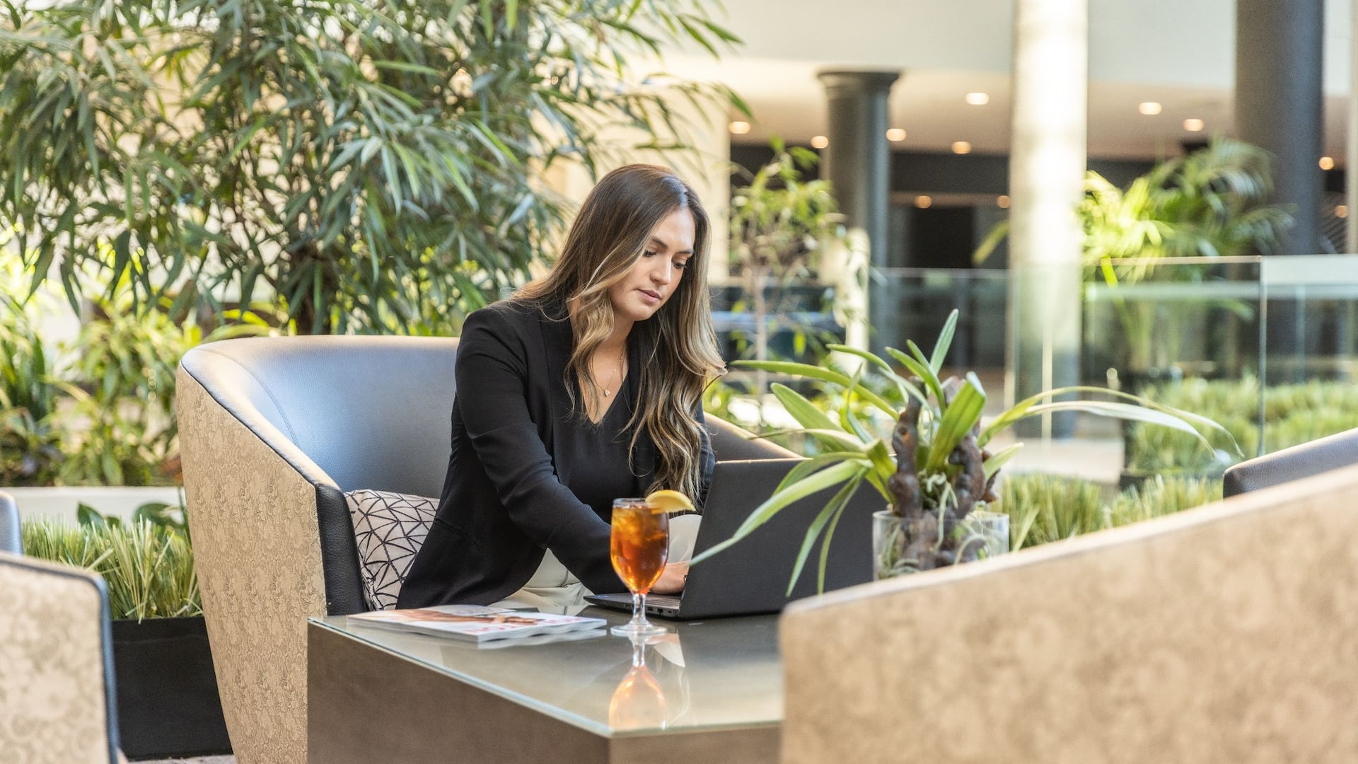 Hyatt Regency Houston West Woman Sitting Lobby Laptop