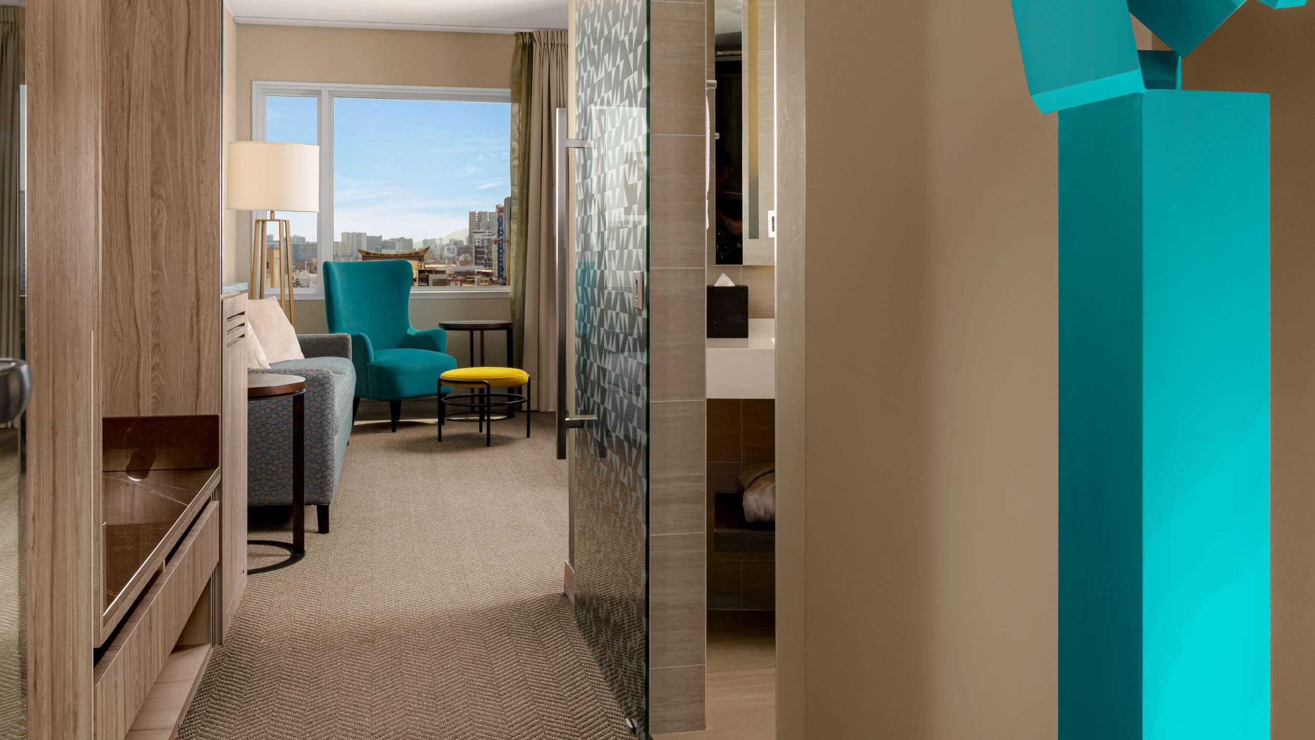 Entryway into the guest room with a closet area and views into the bedroom and bathroom