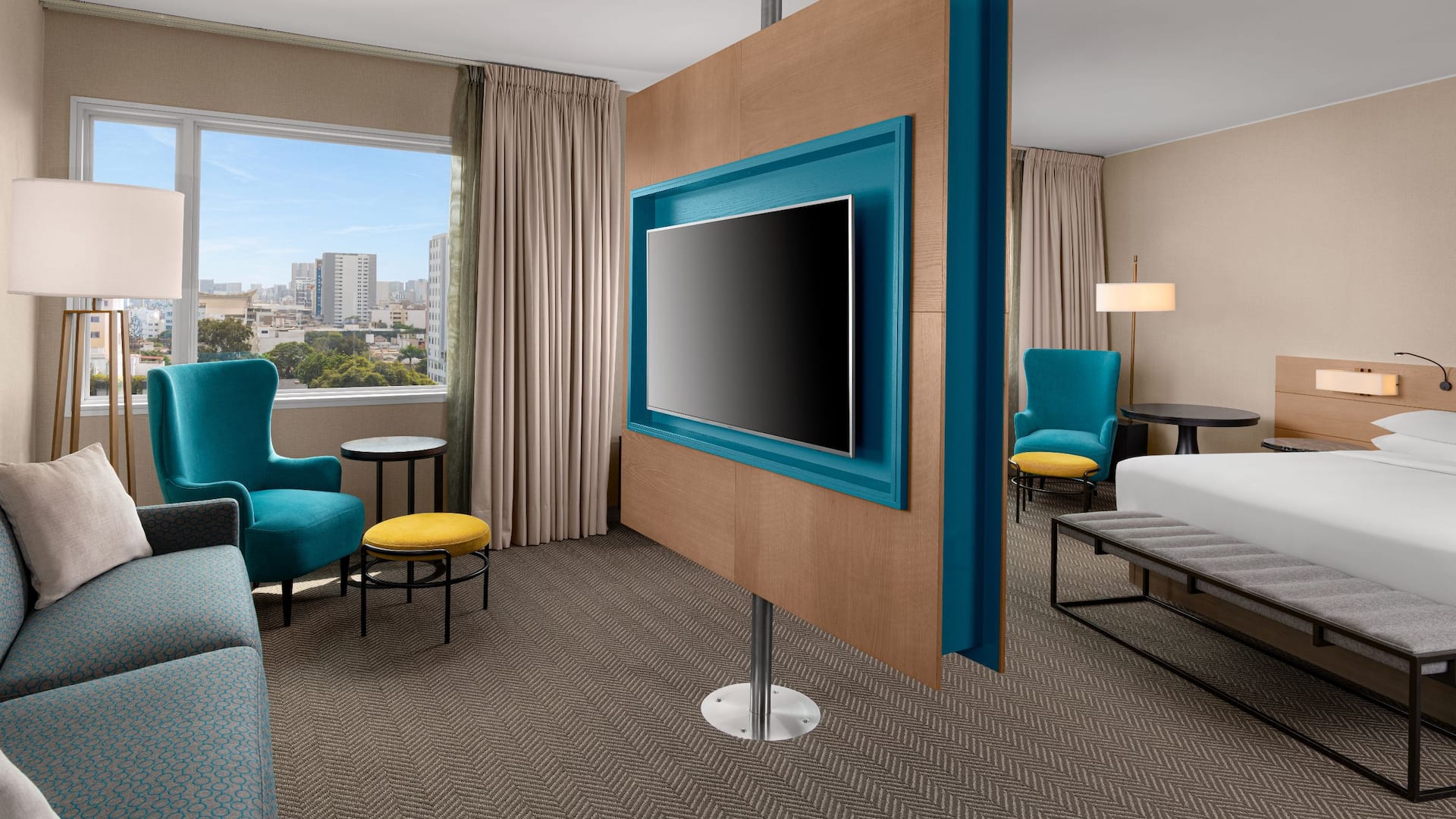 1 de 1 Junior Suite with King Bed sitting area with large television, sofa and chair