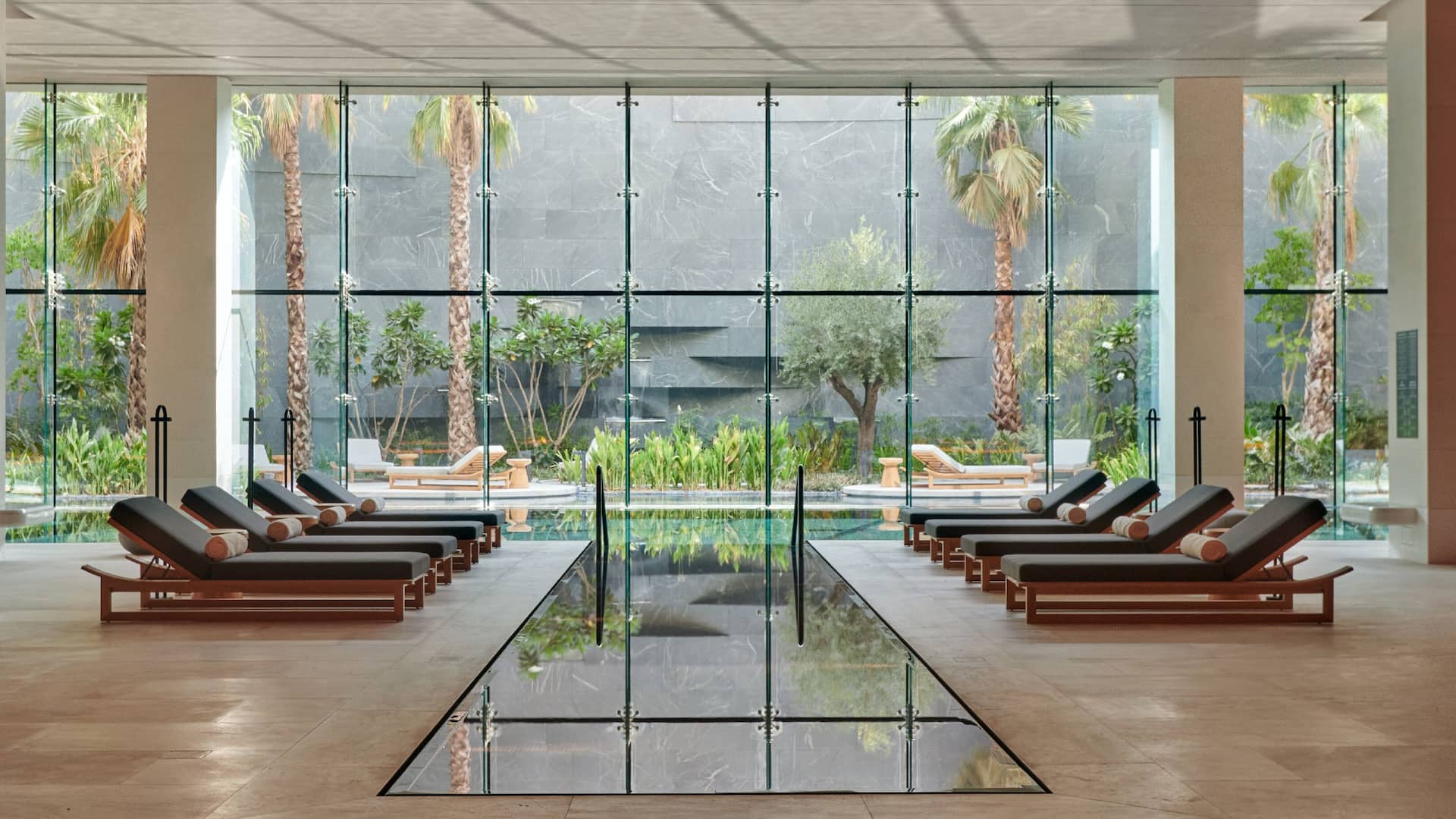Indoor swimming pool with natural light and private garden at Noor Spa at Grand Hyatt Kuwait