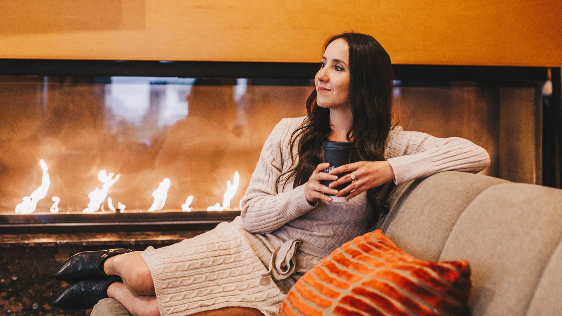 Hyatt Regency Bellevue on Seattle's Eastside Lobby Fireplace Woman Relaxing