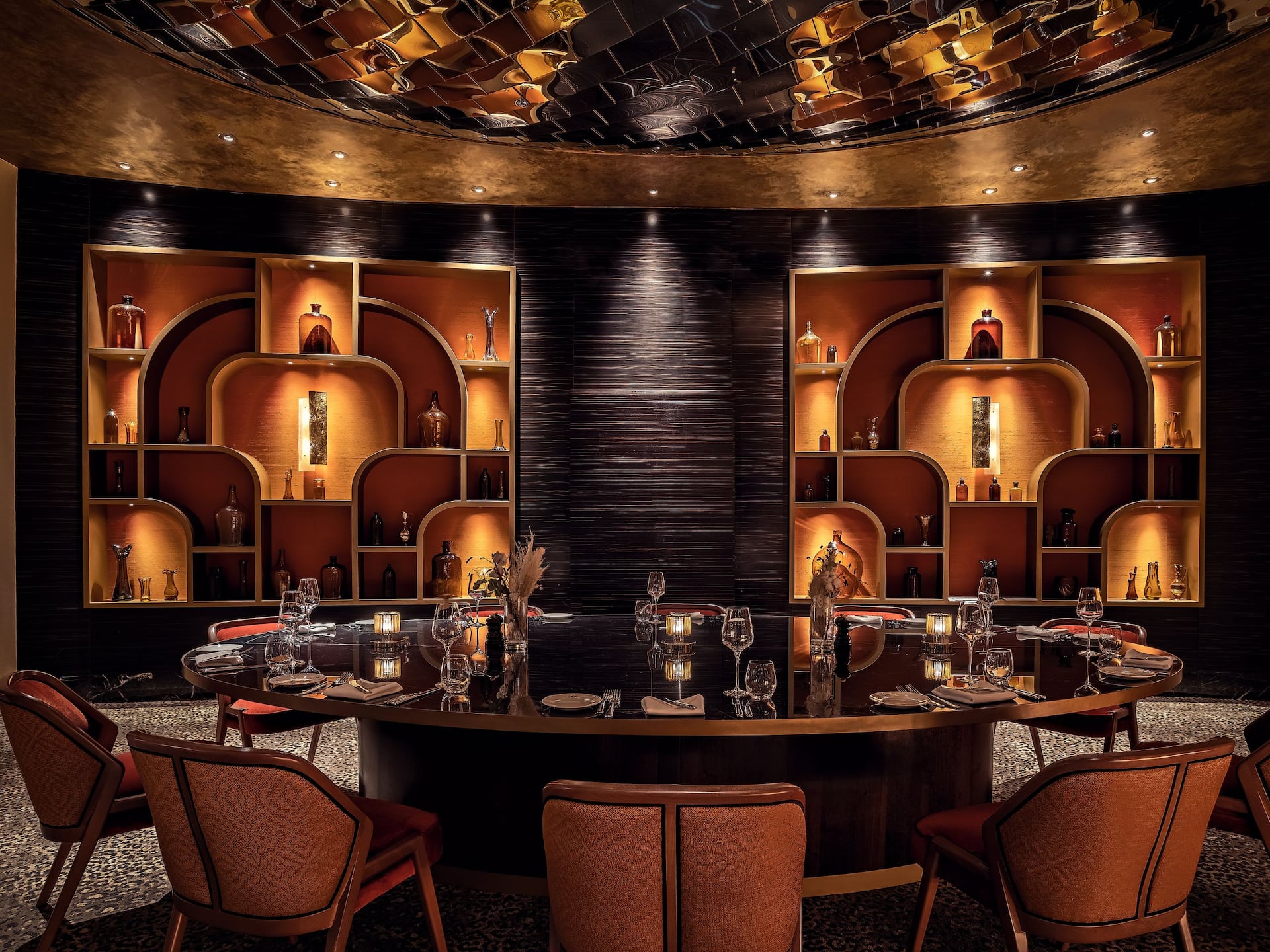 DOX Restaurant at Hyatt Regency Dusseldorf Private dining room with glass walls, large 14 seat table, and gold accents