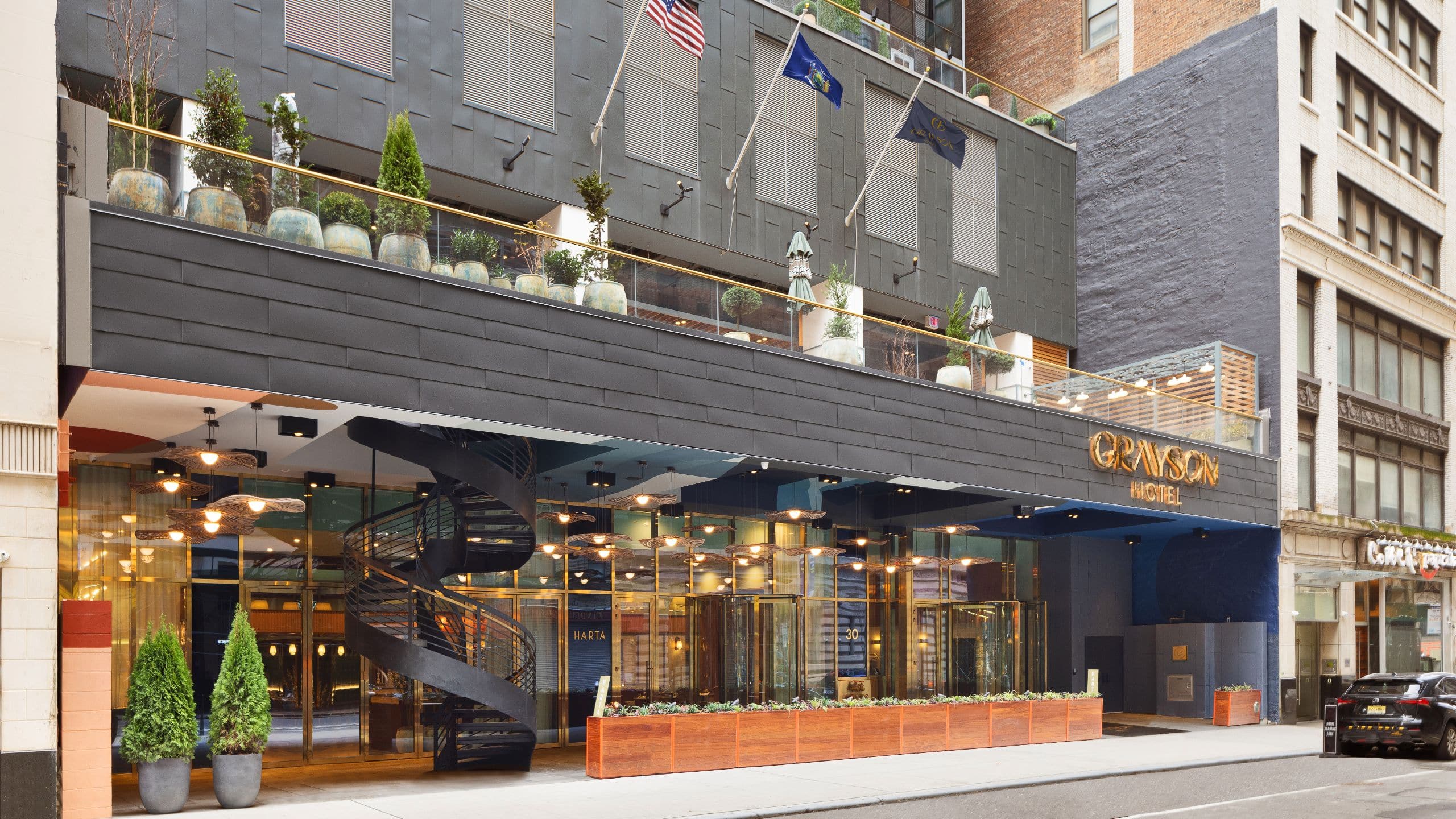 NYC Hotels Near Times Square - NYCUB P0029 Exterior Entrance Flags.16x9 map of hotels near times square