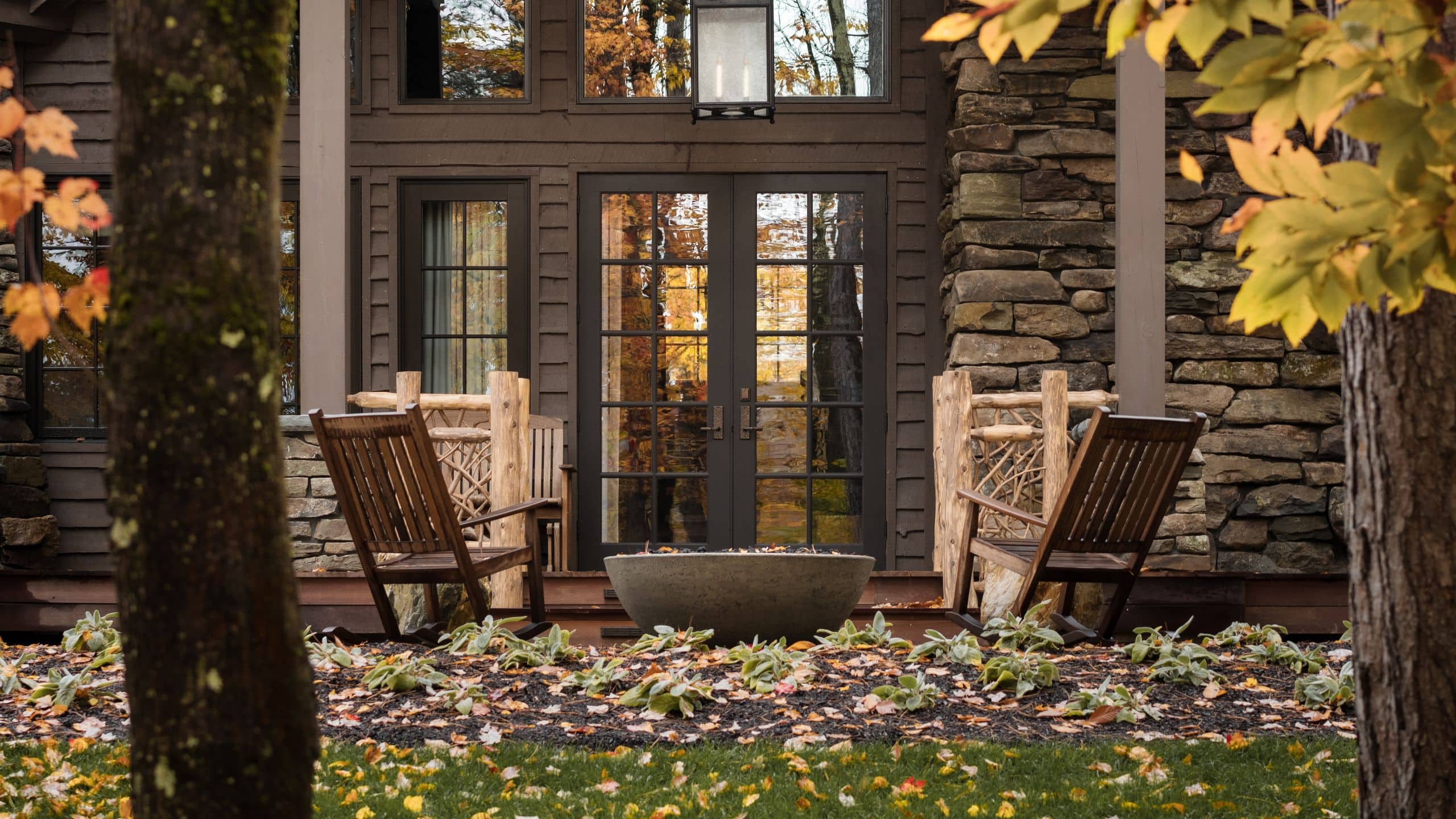 11 of 12 The Chatwal Lodge Stone Cottage Fall Through The Trees Firepit