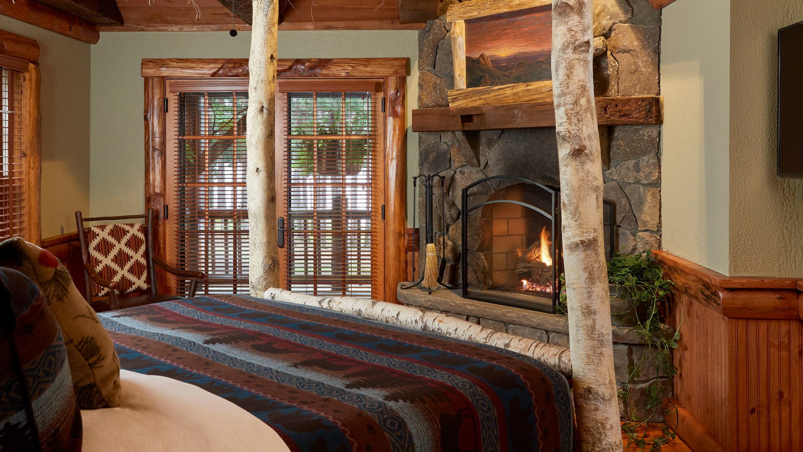 1 of 8 The Chatwal Lodge Elk Retreat King Bedroom Fireplace