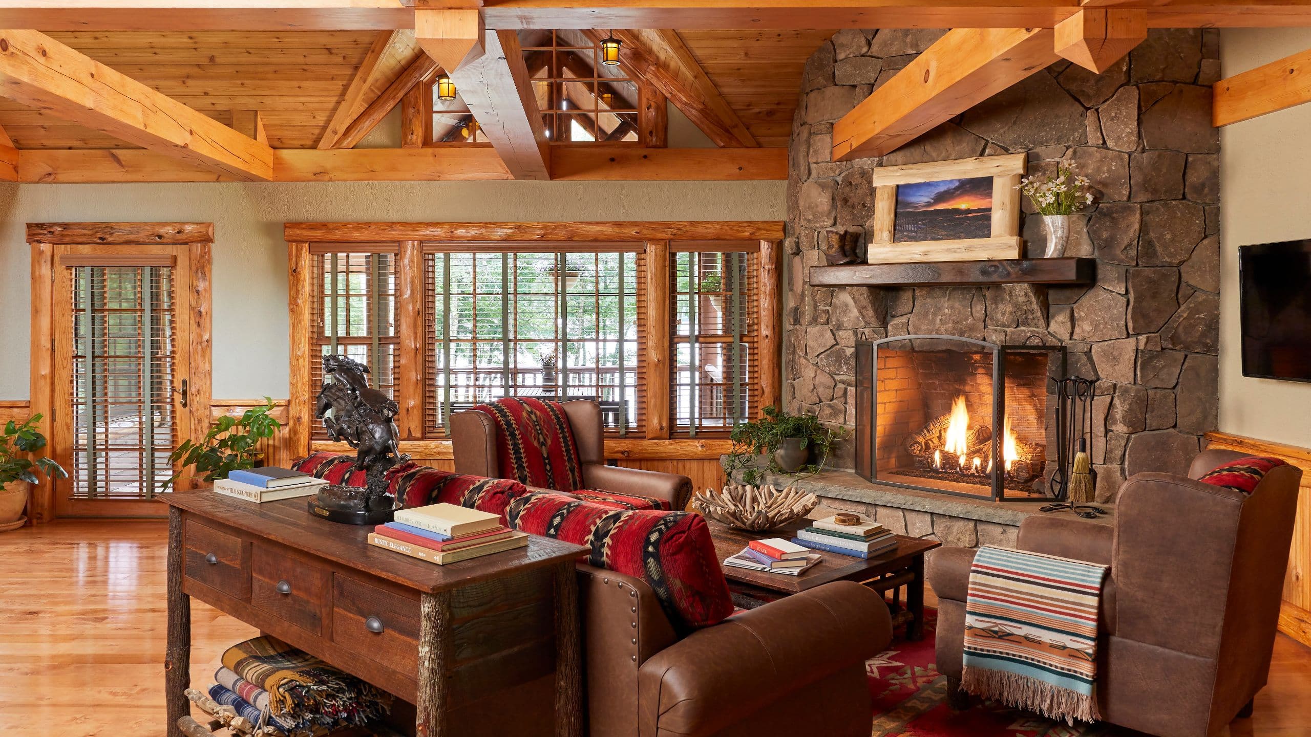 2 of 8 The Chatwal Lodge Guestroom Sunset Living Room Fireplace