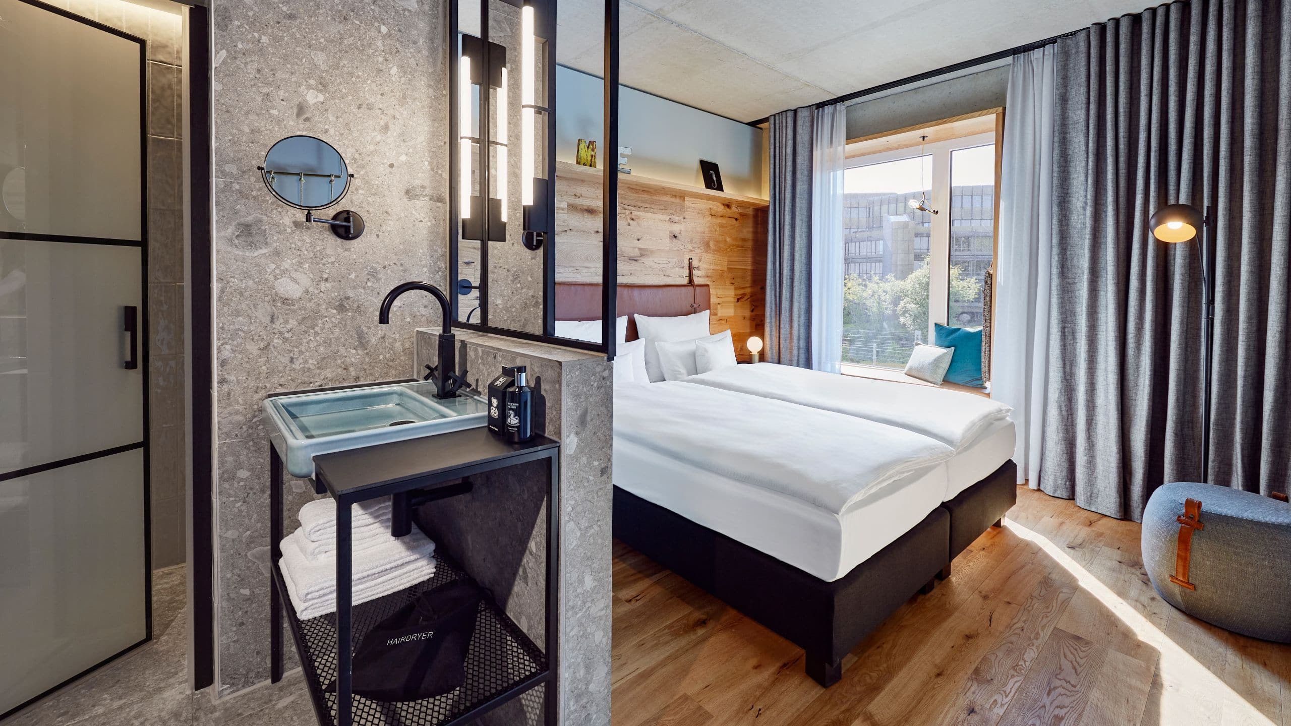 Overview of a stylish hotel room with a king-size bed.
