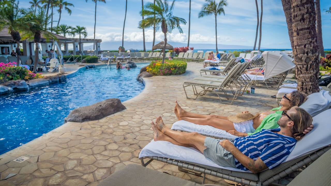 Lounge poolside as you listen to the waves crash on Kaanapali Beach in the distance.