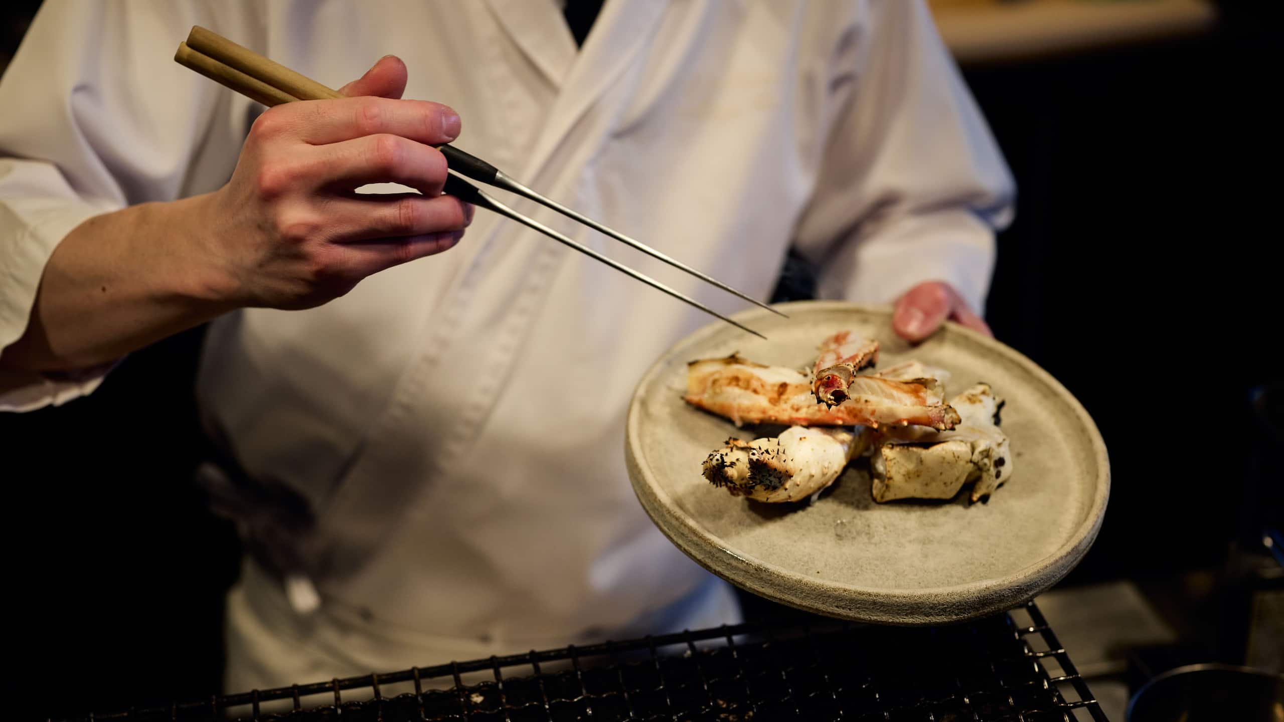 Park Hyatt Niseko Hanazono Robata Grill Detail Chef Holding Plate