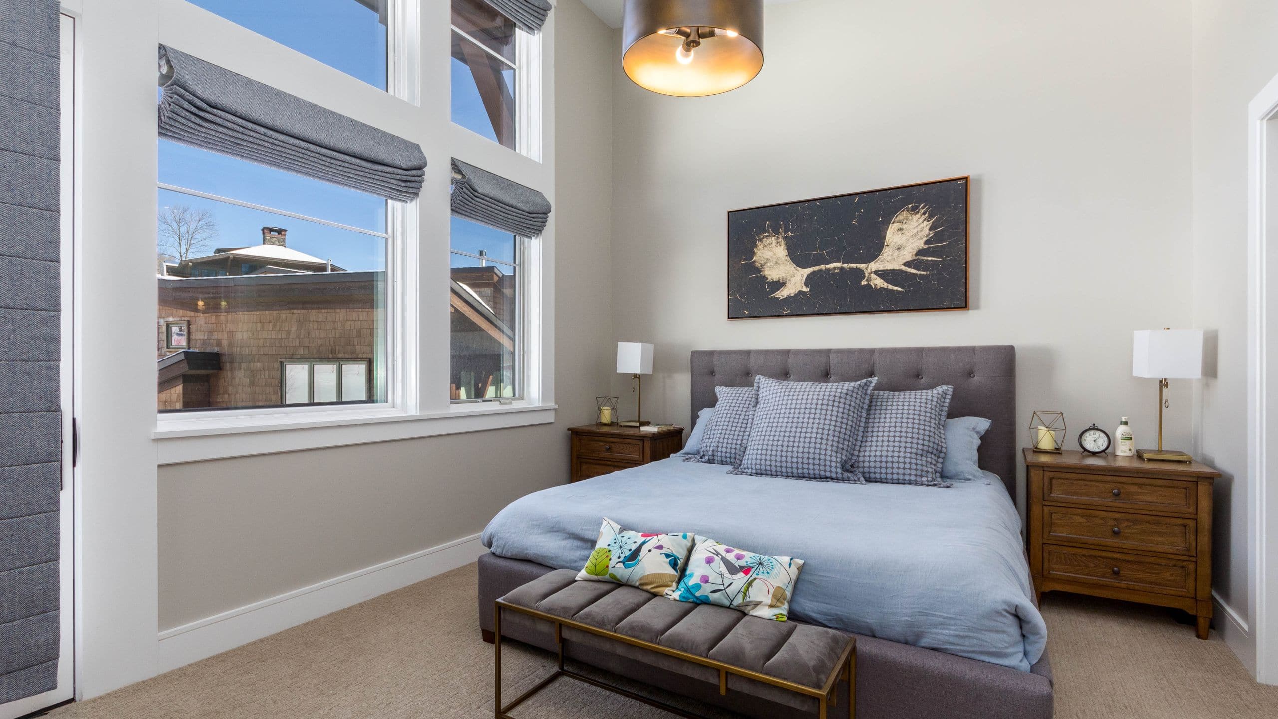 2 of 5 The Lodge at Spruce Peak Townhome Bedroom Bed End Tables