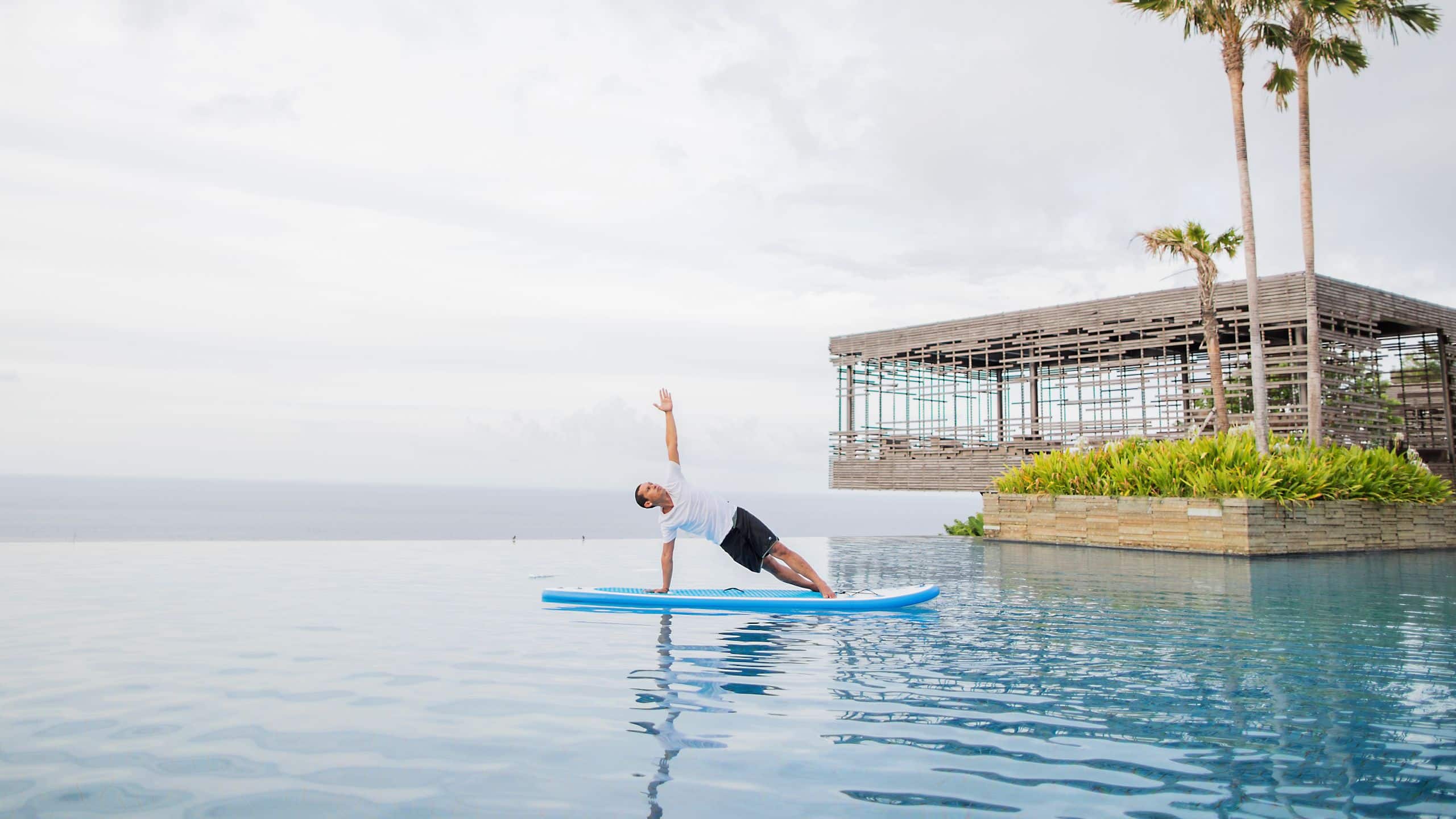 Alila Villas Uluwatu Alila Villas Uluwatu Stand Up Paddleboard Yoga Pose