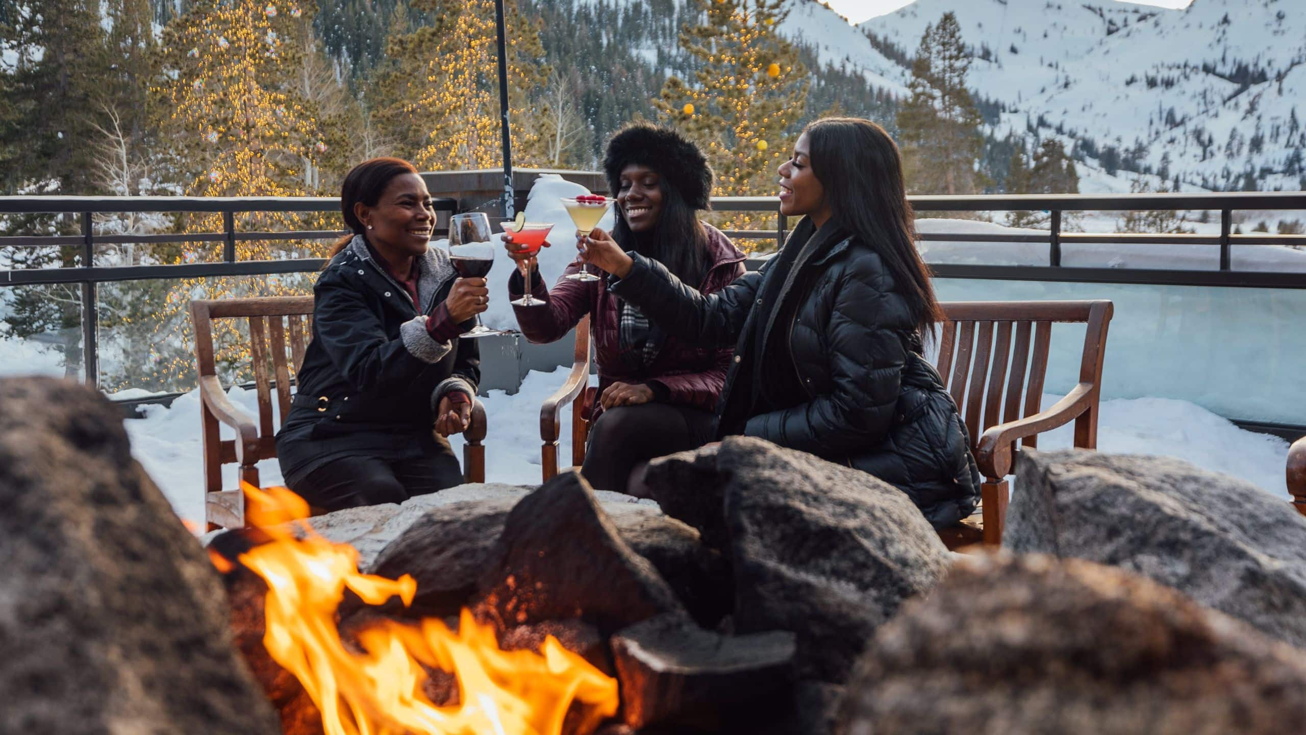 Everline Resort & Spa Guests Drinking Around Fire