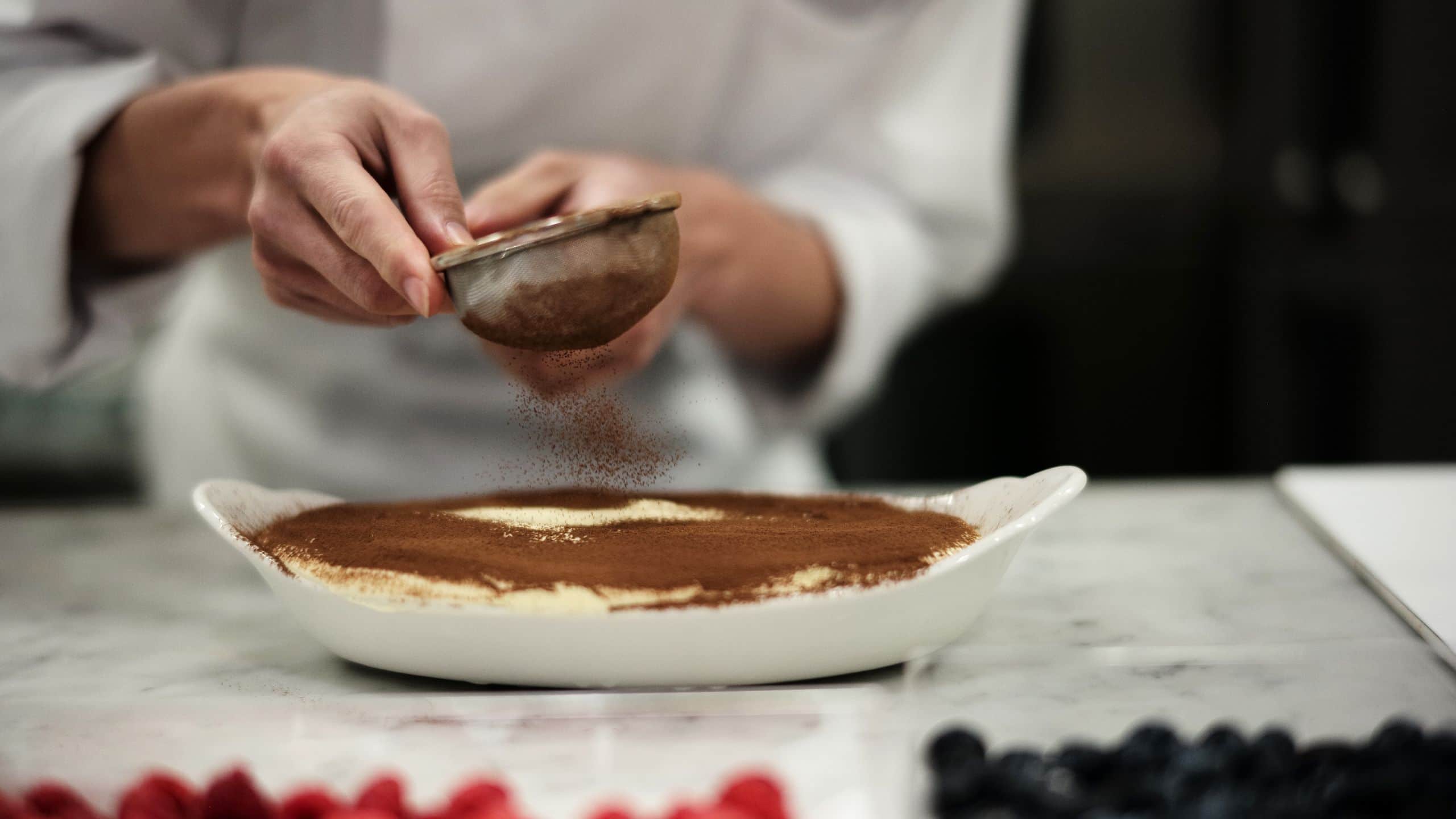 Fuji Speedway Hotel Pastry Chef Sprinkling Cocoa On Tiramisu At Kitchen