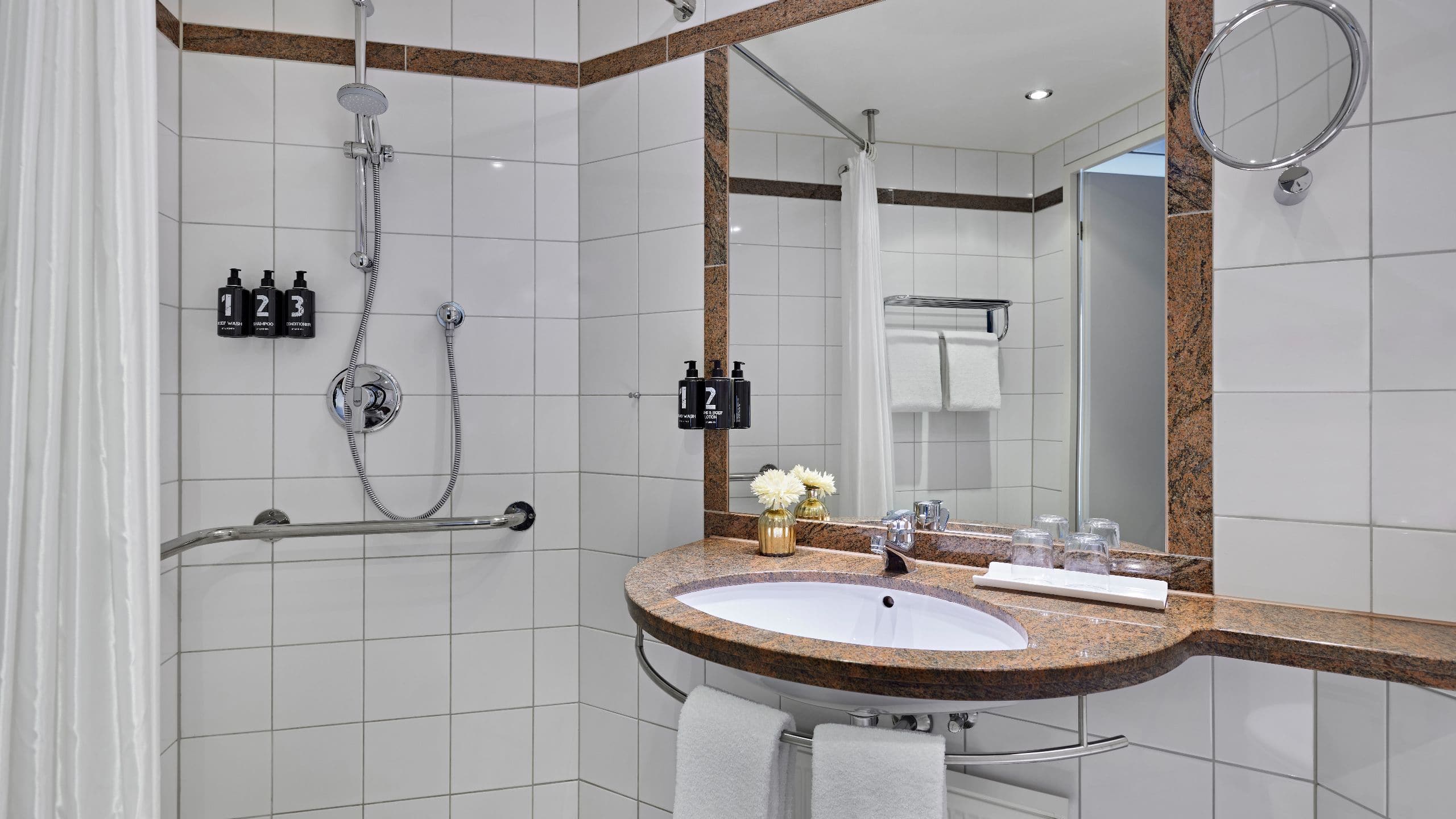 2 of 5 Lindner Hotel BayArena One King Bed Accessible Shower Bathroom