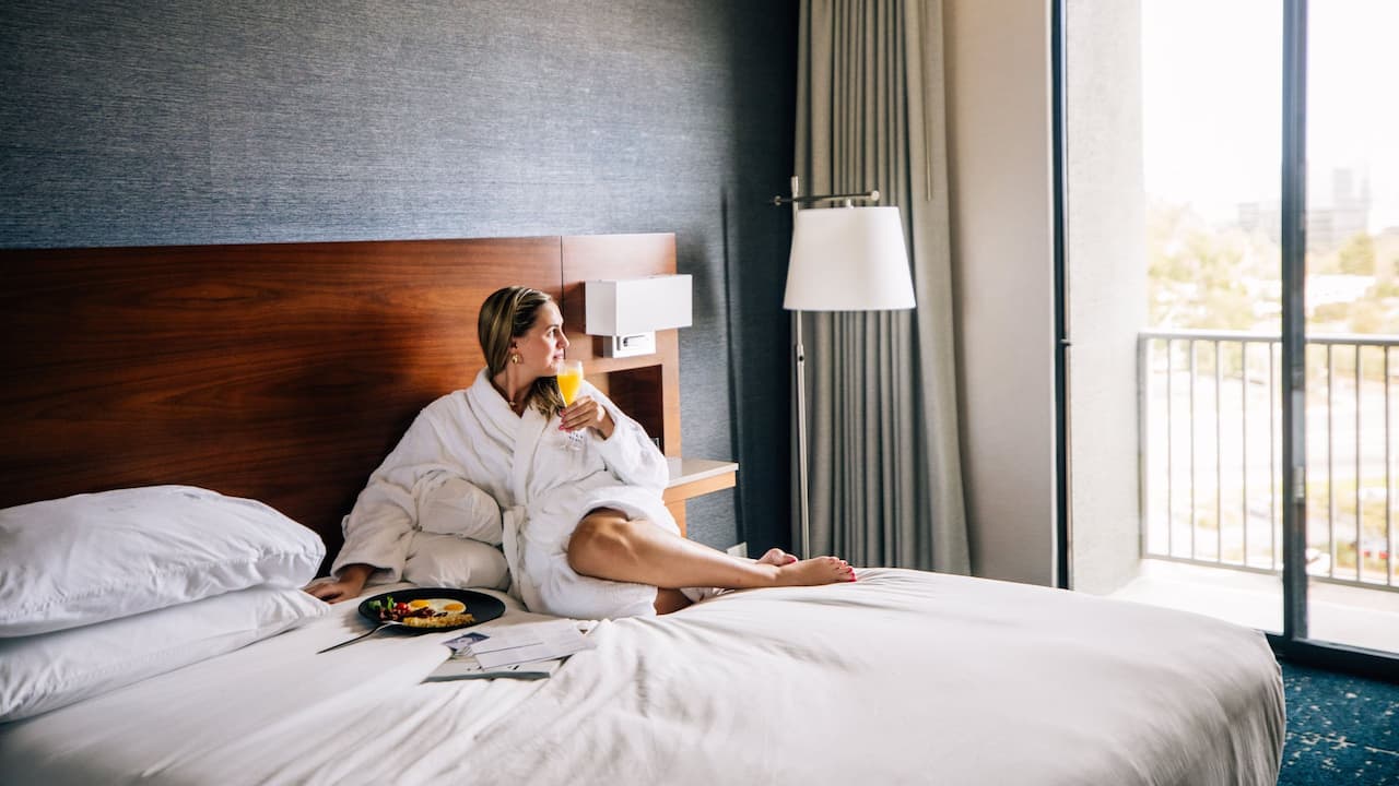 Guest With Breakfast In Bed