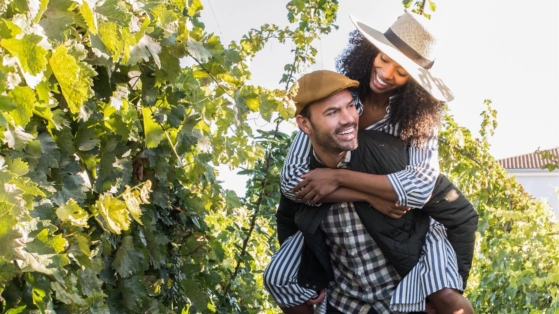 Hyatt Regency Sonoma Wine Country Couple Piggy Back Ride In Vineyard