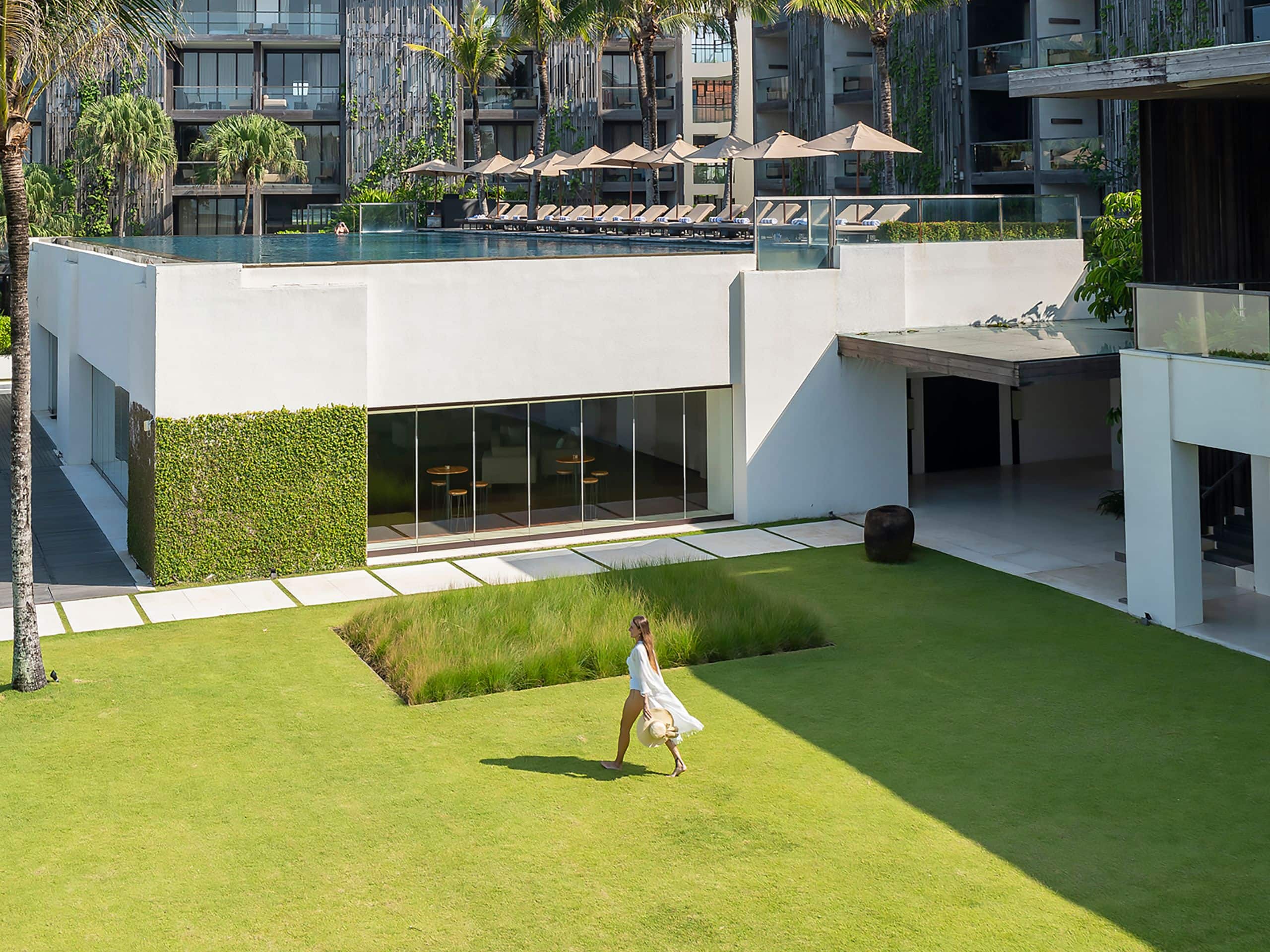 Alila Seminyak Woman At Temple Garden