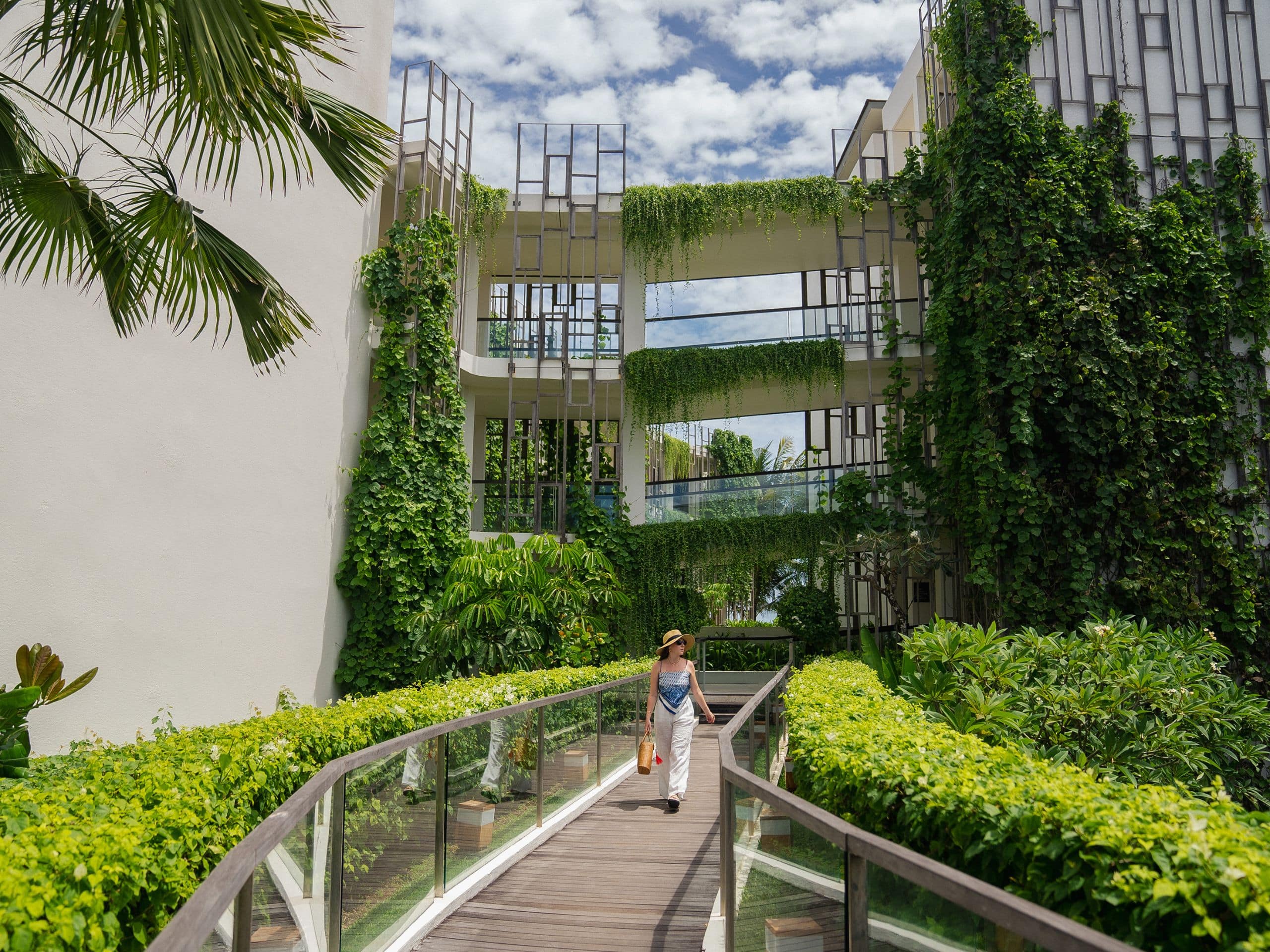 Alila Seminyak Woman At Connecting Bridge