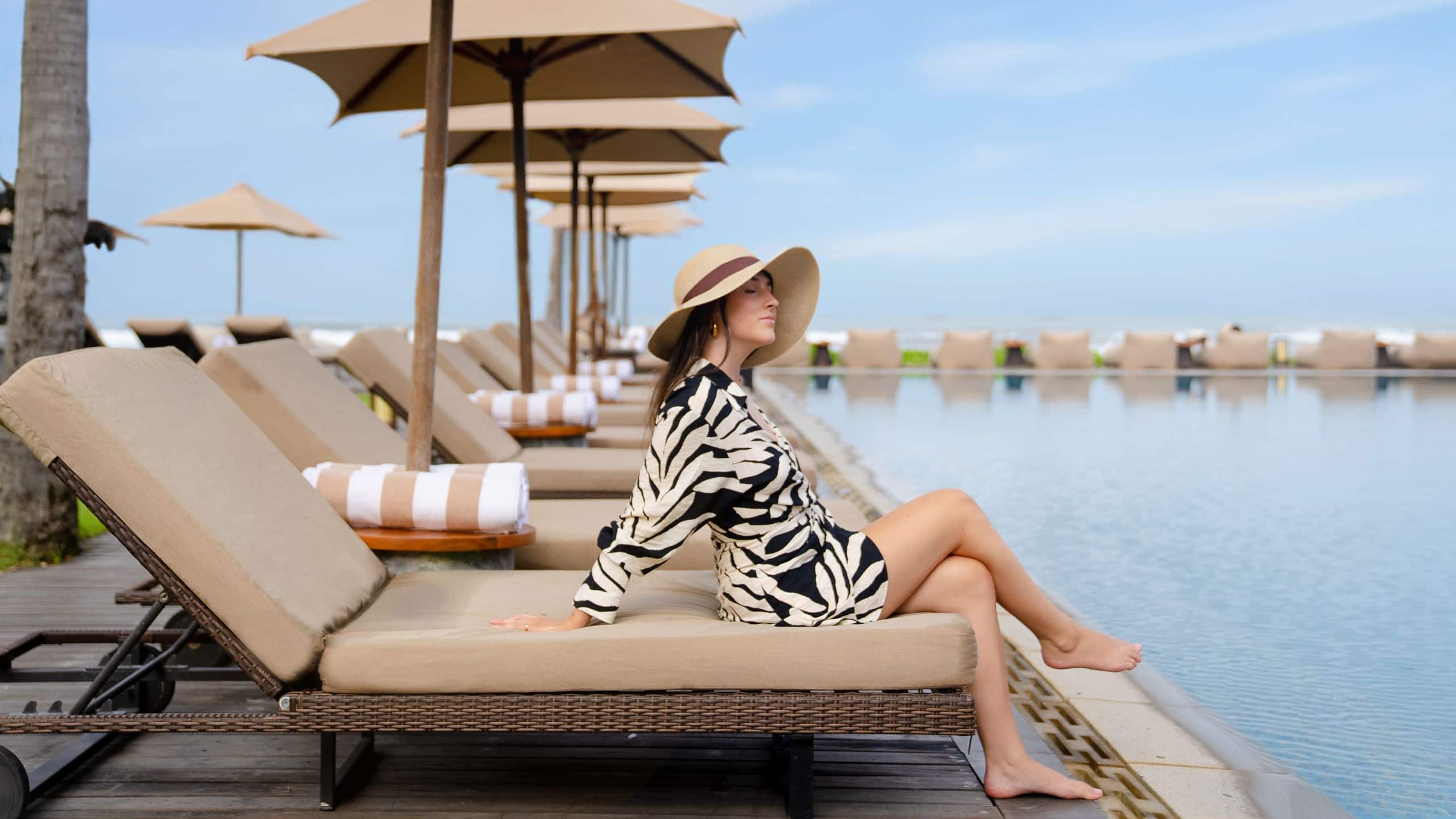 Alila Seminyak Woman At Sun Loungers