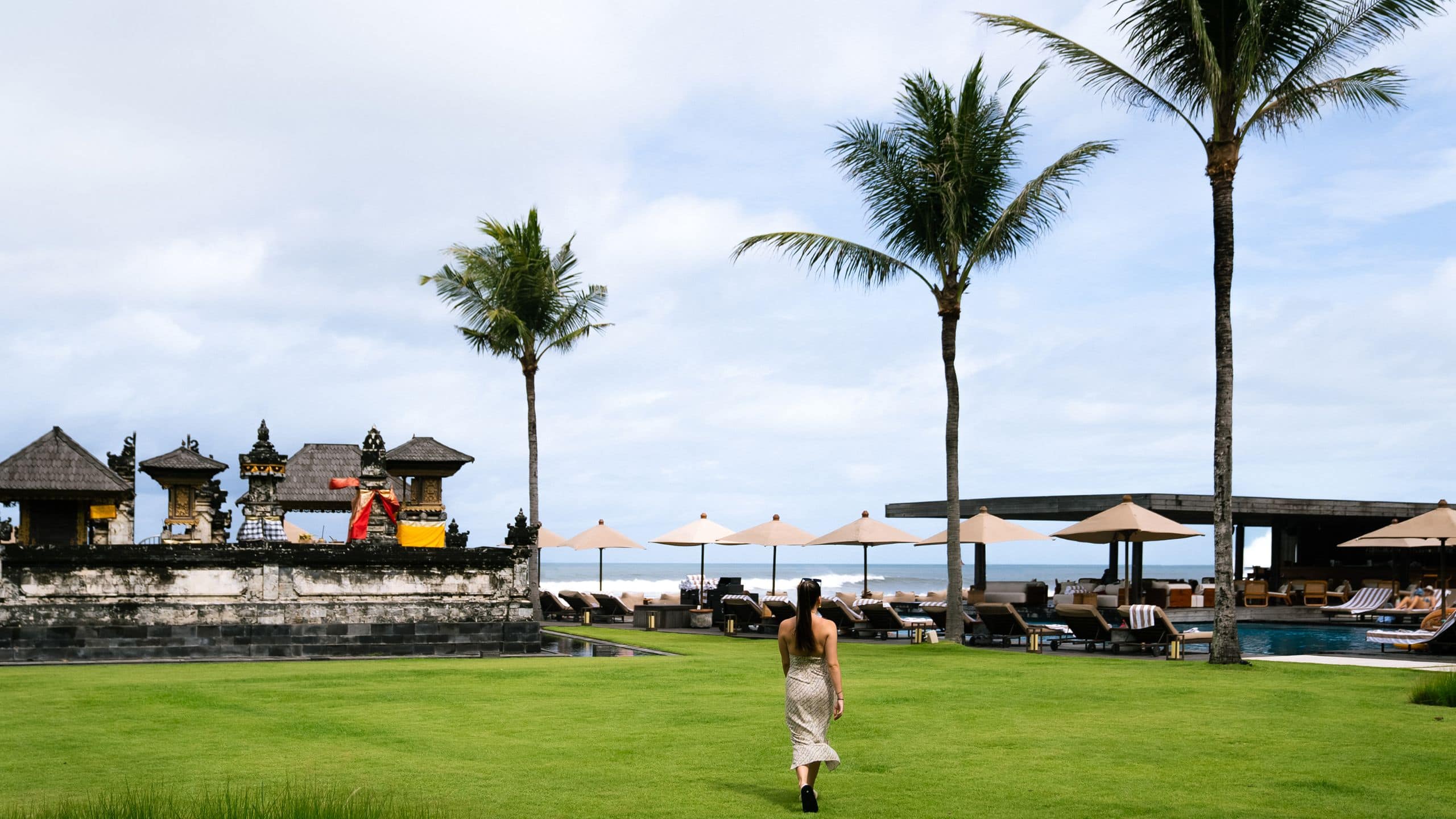 Alila Seminyak Woman At Temple Garden