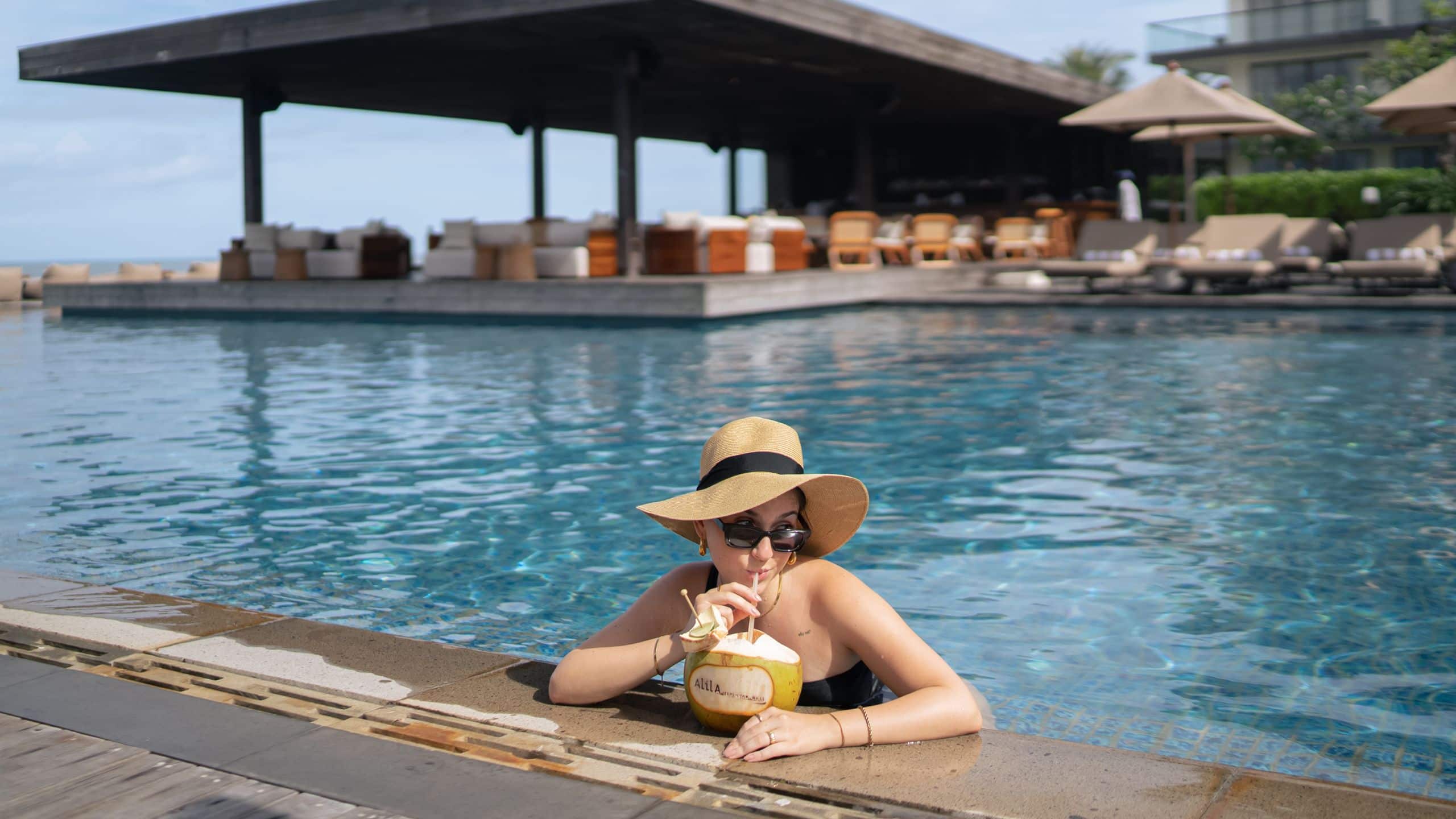 Alila Seminyak Woman Relaxing At The Pool