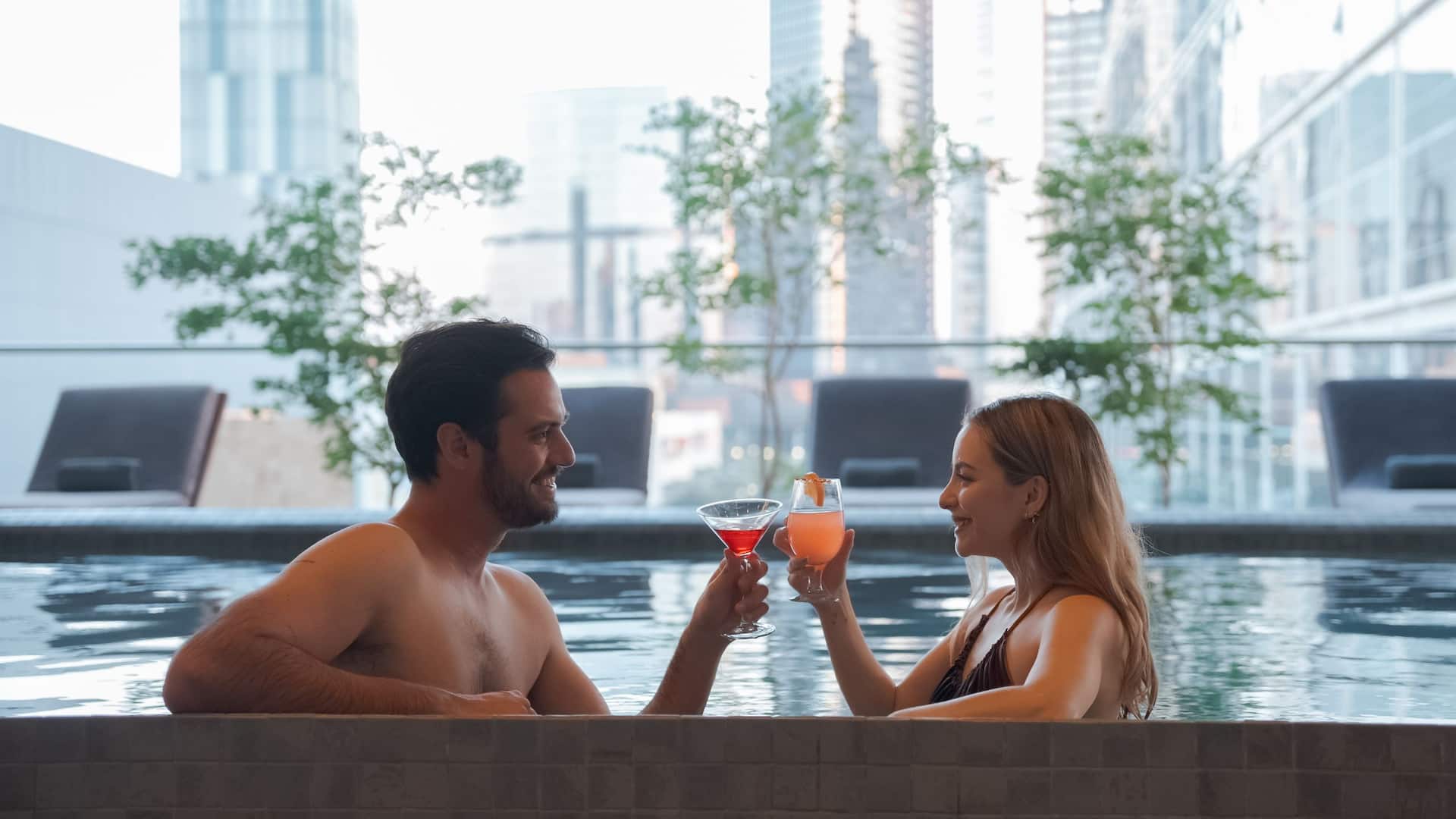 Hyatt Regency Andares Guadalajara Couple In Pool Toasting  Drinks