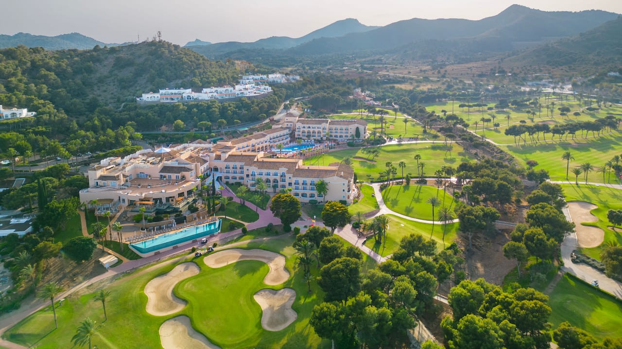 Hotel Exterior Aerial Pools Golf Course Mountains