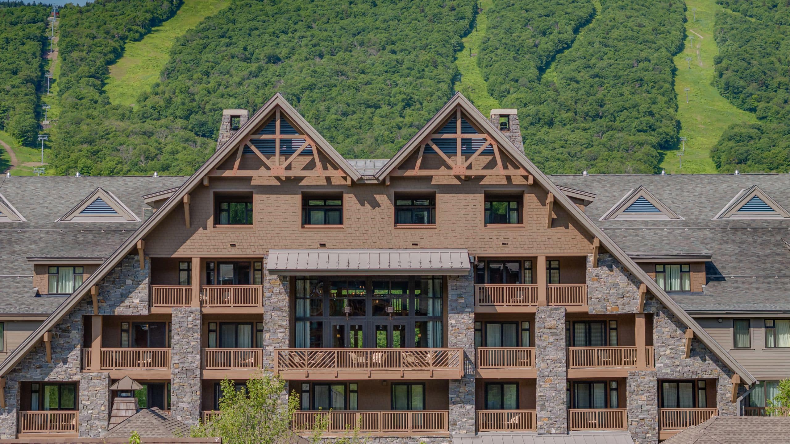 The Lodge at Spruce Peak Summerdrone Closeup