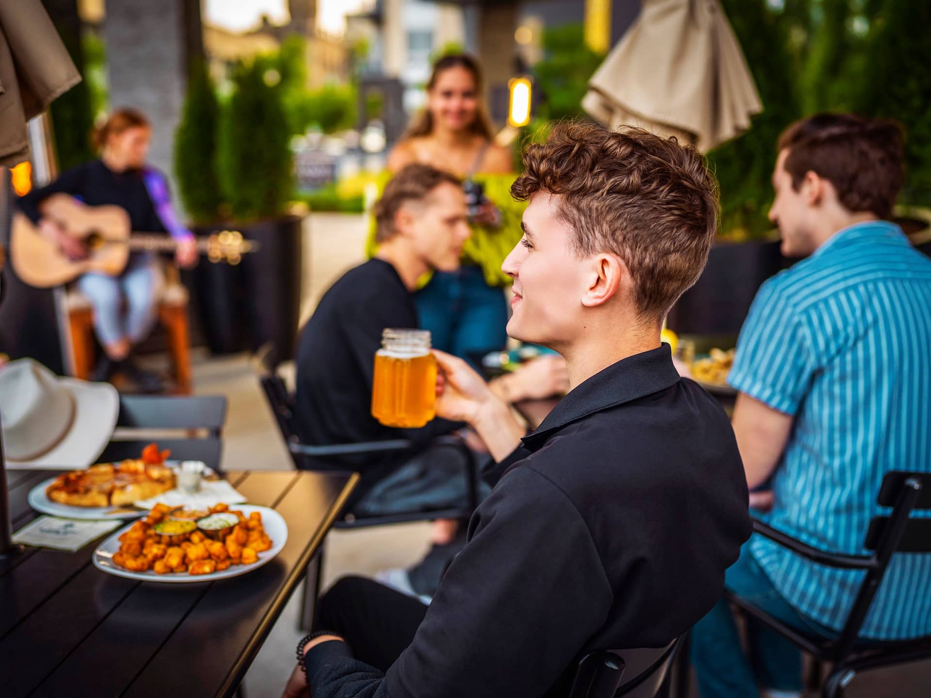Hyatt Place Milwaukee Downtown Patio Guest Drinking Beer