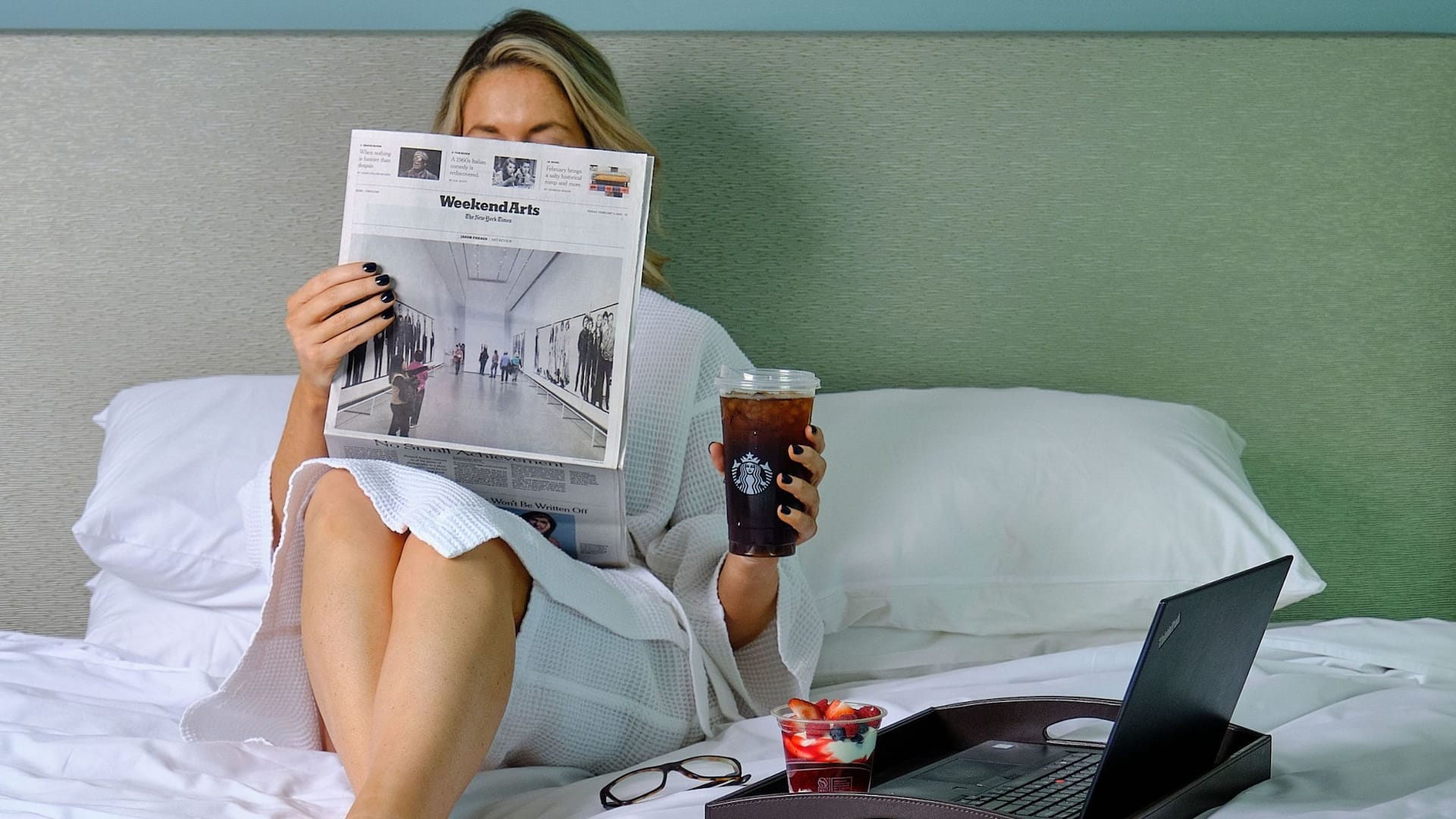 Hyatt Regency Jacksonville Riverfront Guest Reads Newspaper Alongside Starbucks