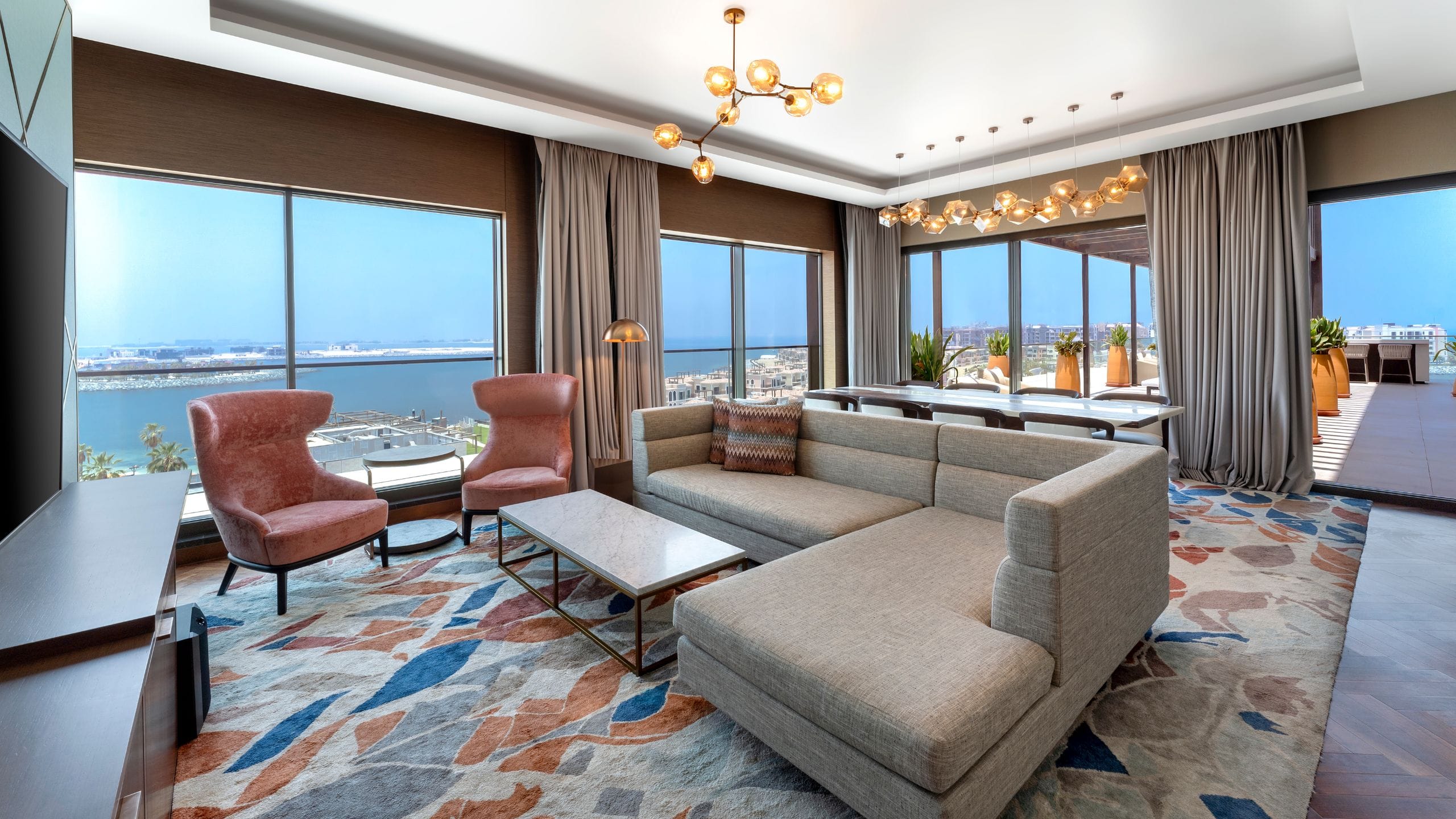 1 of 11 The living area of the Hotel Terrace Suite at Hyatt Centric Jumeirah Dubai, showcasing comfortable seating & contemporary design