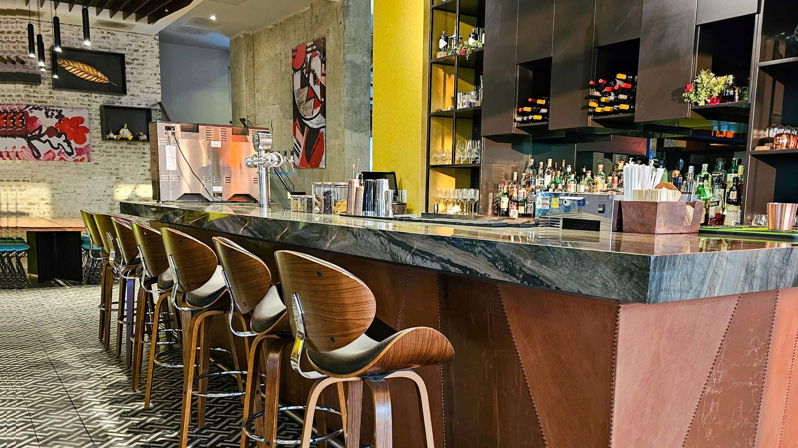 1 of 3 Hyatt Centric San Salvador Bar Seating Area