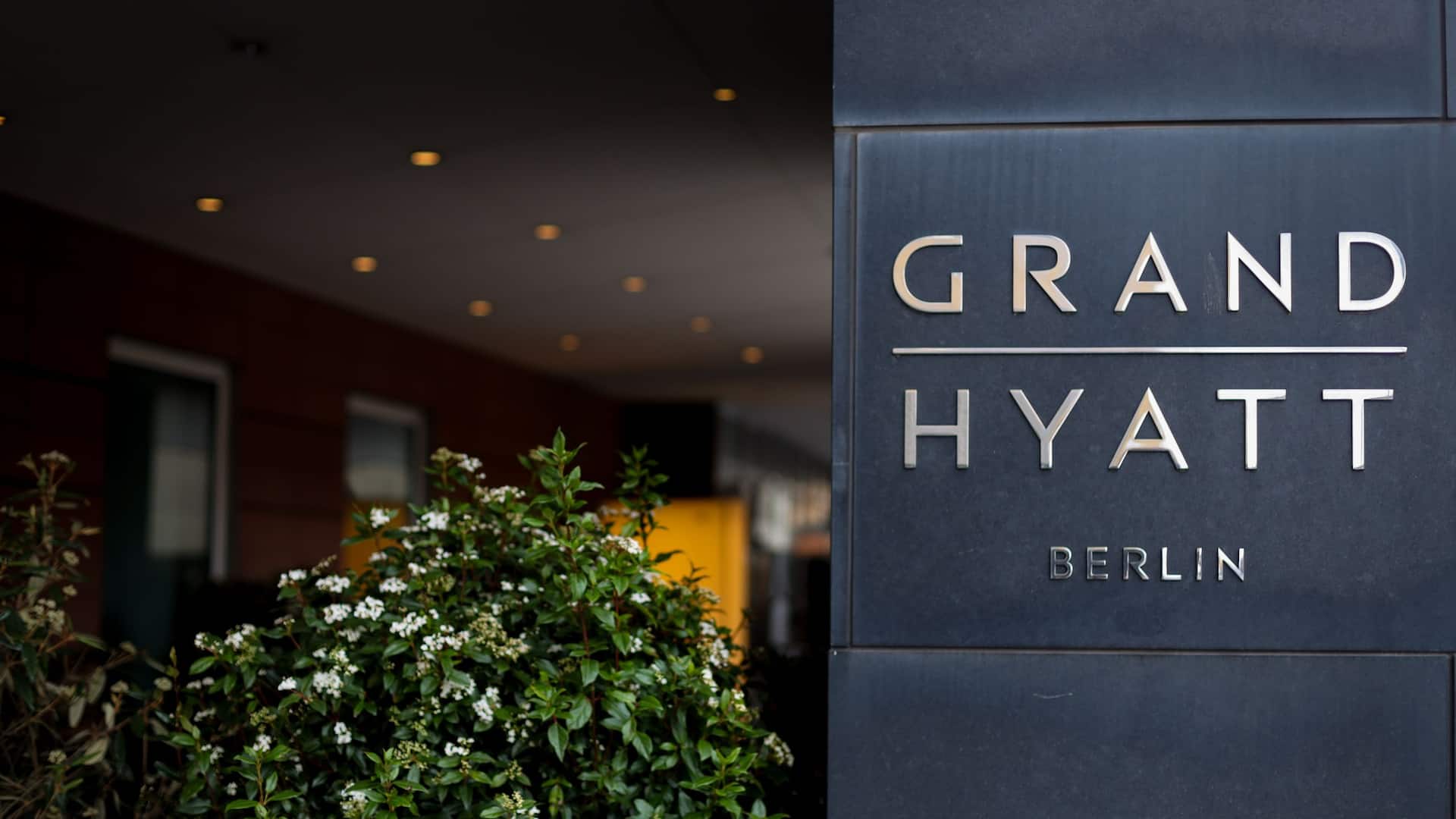 Entrance of Grand Hyatt Berlin and logo of hotel