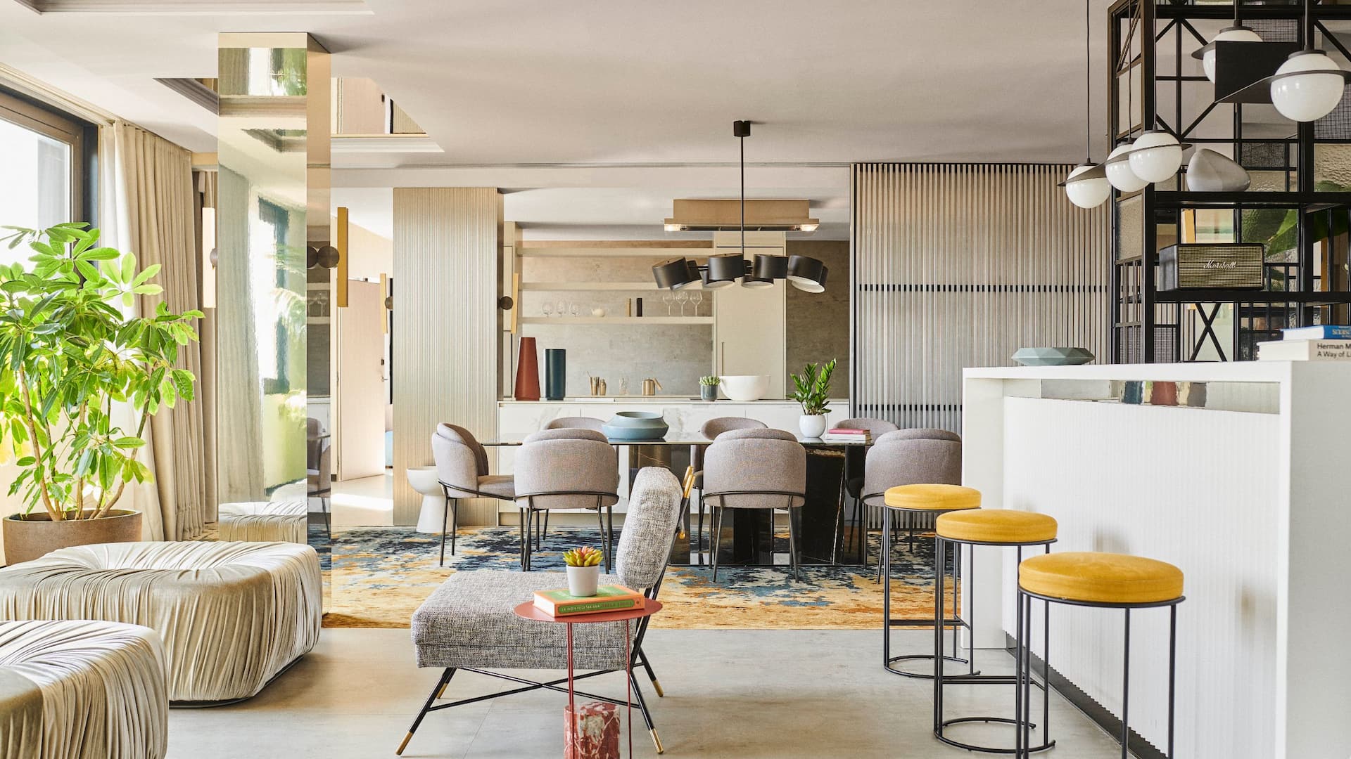 Modern open-plan living Penthouse with a kitchen, dining area, and lounge, featuring stylish furniture and ample natural light, designed to reflect the elegance of a five-star luxury hotel.