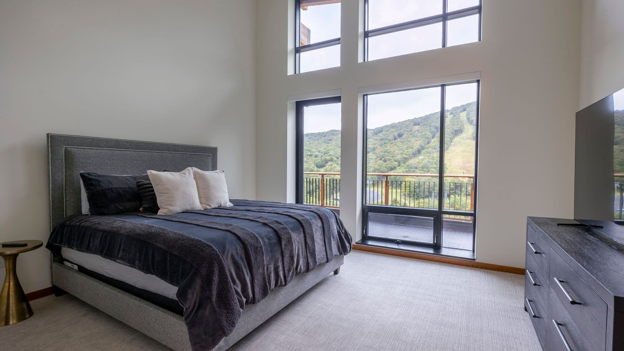 1 of 5 The Lodge at Spruce Peak OSP Five Bedroom Residence Bedroom Television