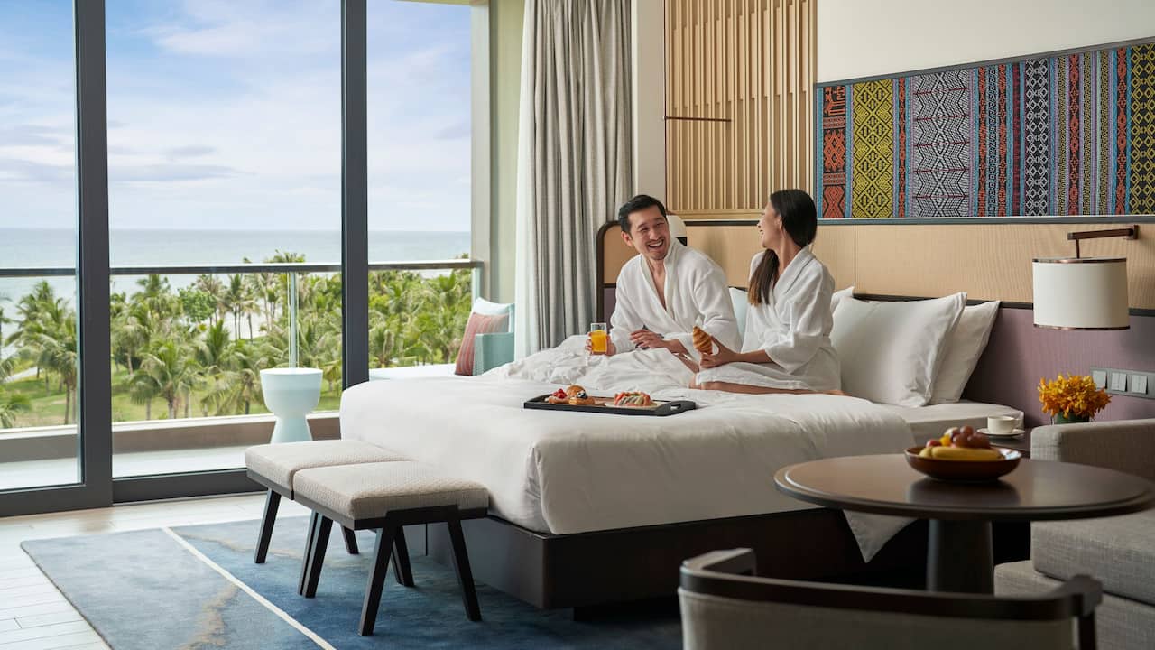 Couple In Ocean View Suite Room Service