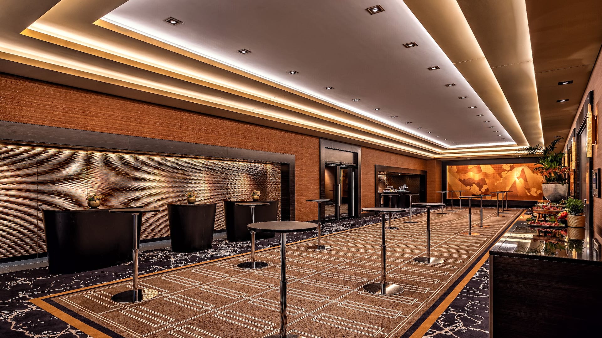 Ballroom Foyer at the Hyatt Regency Dusseldorf, in gold brown design and bar tables
