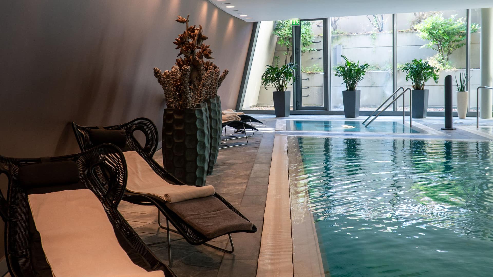 Club Olympus Spa and Fitness loungers next to pool