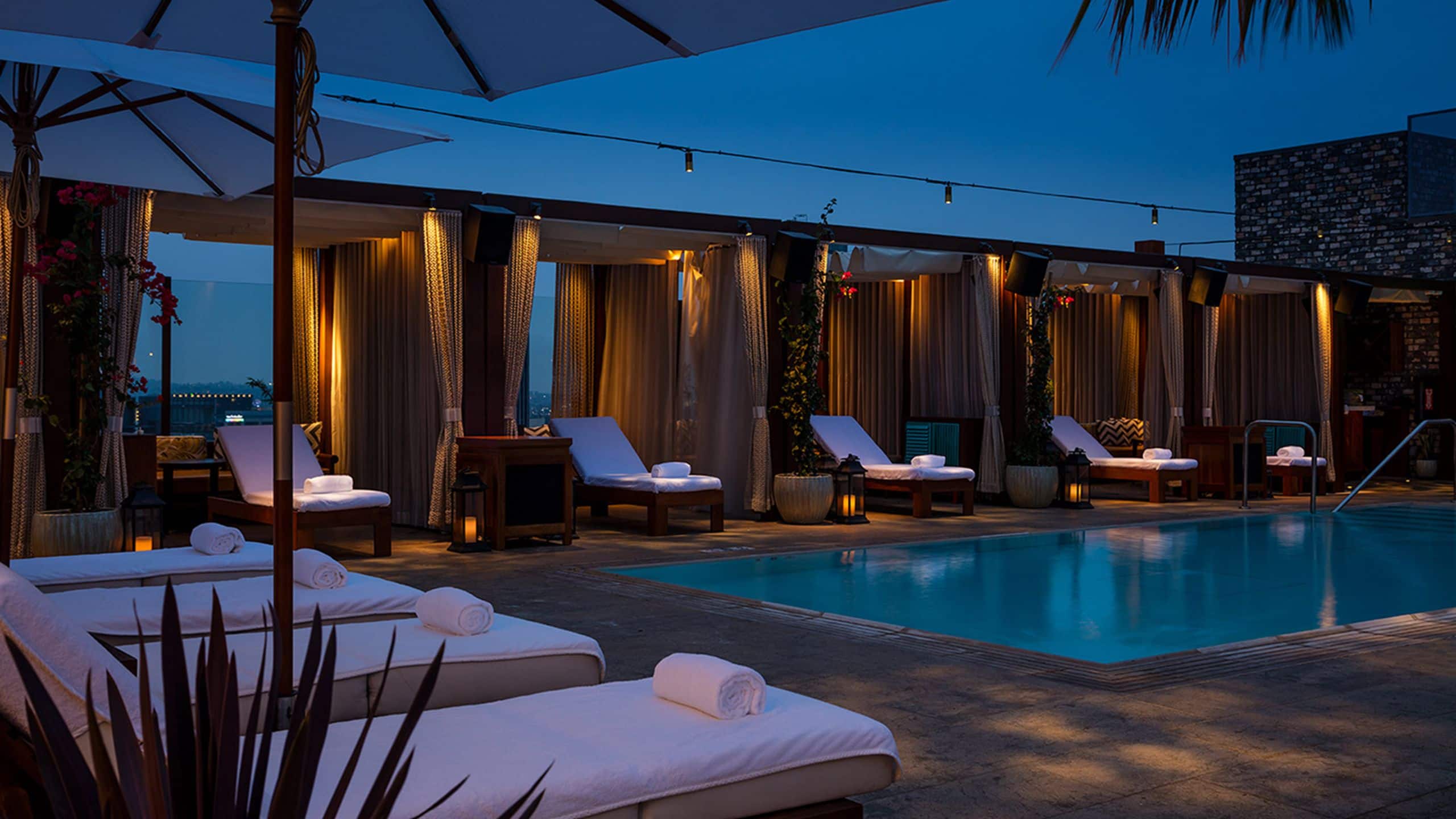Dream Hollywood Pool And Chaises At Nighttime