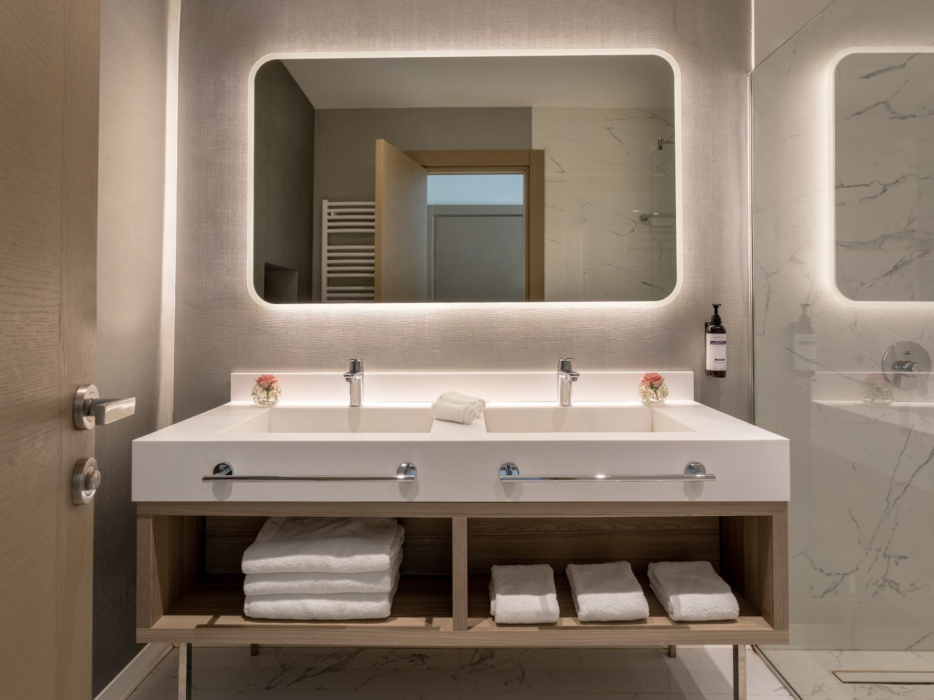 Elegant bathroom in a luxury suite at Hyatt Regency Kotor Bay Resort, Montenegro, featuring a spacious shower and modern amenities