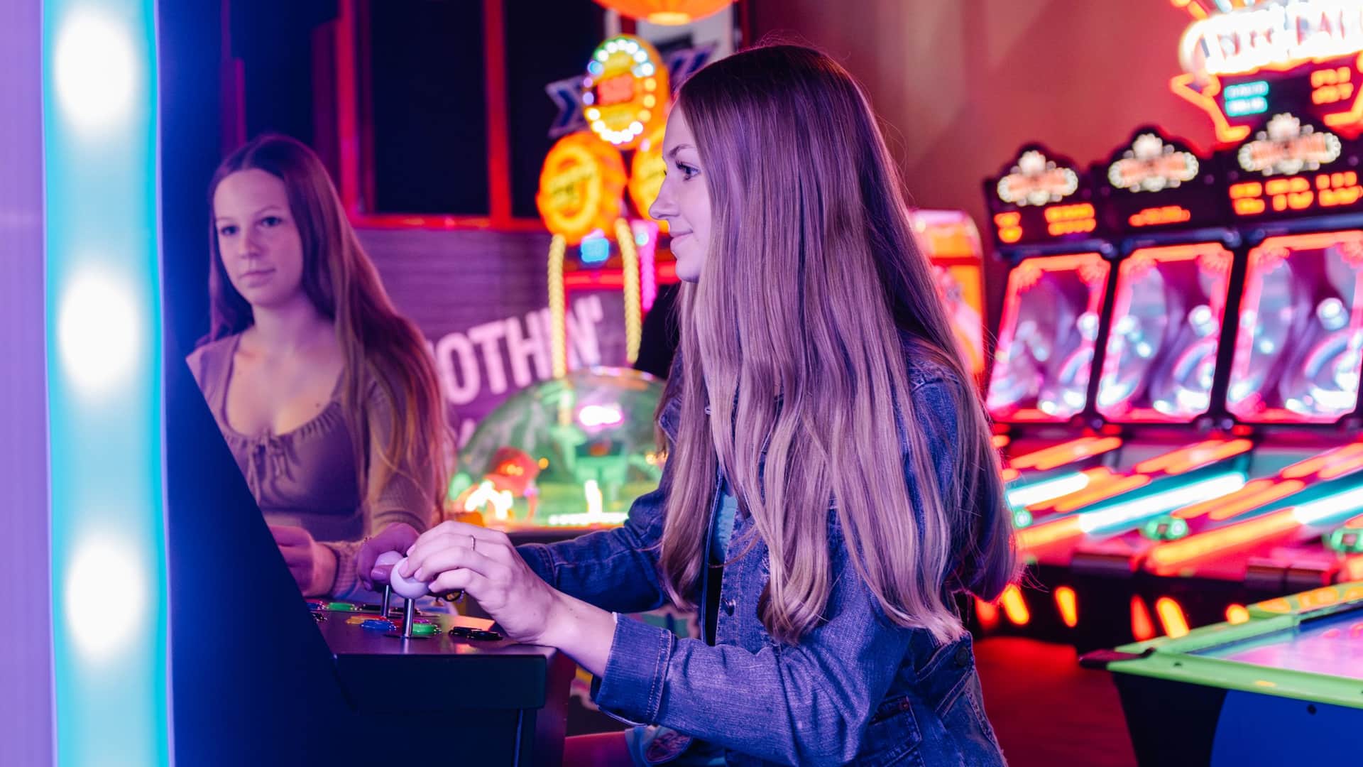 Hyatt Regency Bellevue on Seattle's Eastside Lucky Strike Sisters Playing Arcade Games