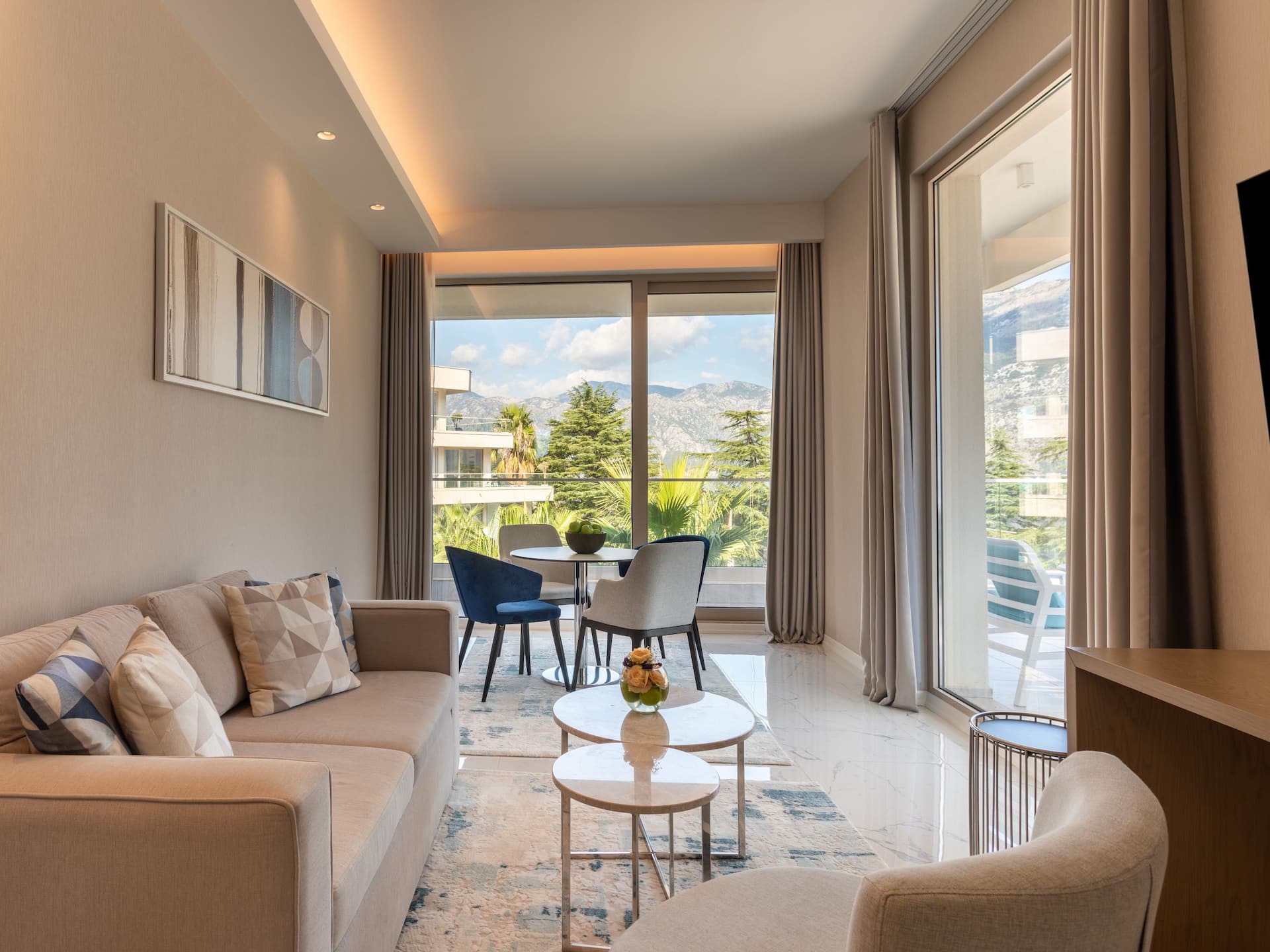 Luxury suite living room in Hyatt Regency Kotor Bay Resort, Montenegro, showcasing elegant furnishings and modern decor
